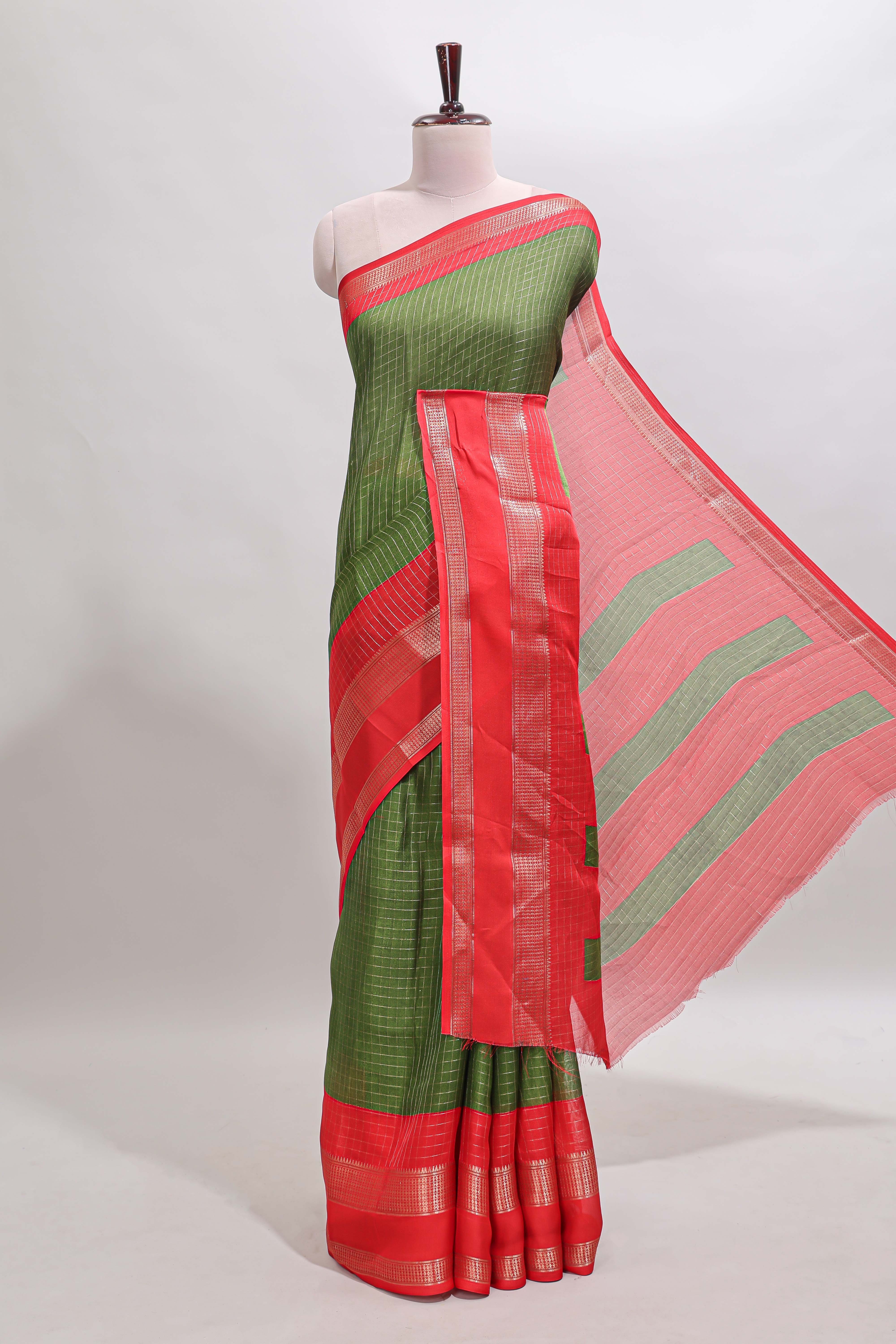 Green checked dola silk saree with contrast zari bentex border and blouse