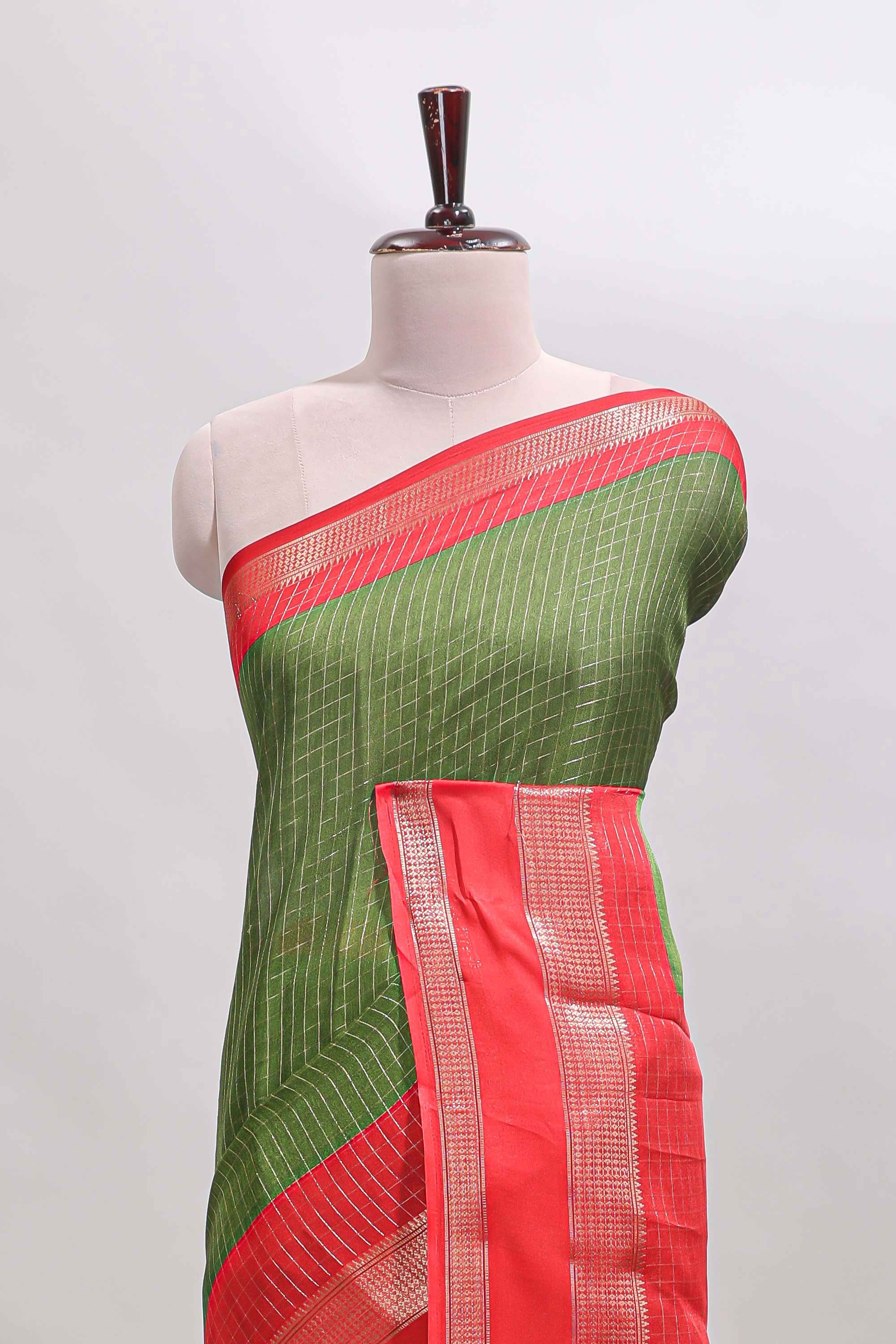 Green checked dola silk saree with contrast zari bentex border and blouse