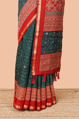 Green chanderi cotton geometric diamond mirror work saree with contrast zari border