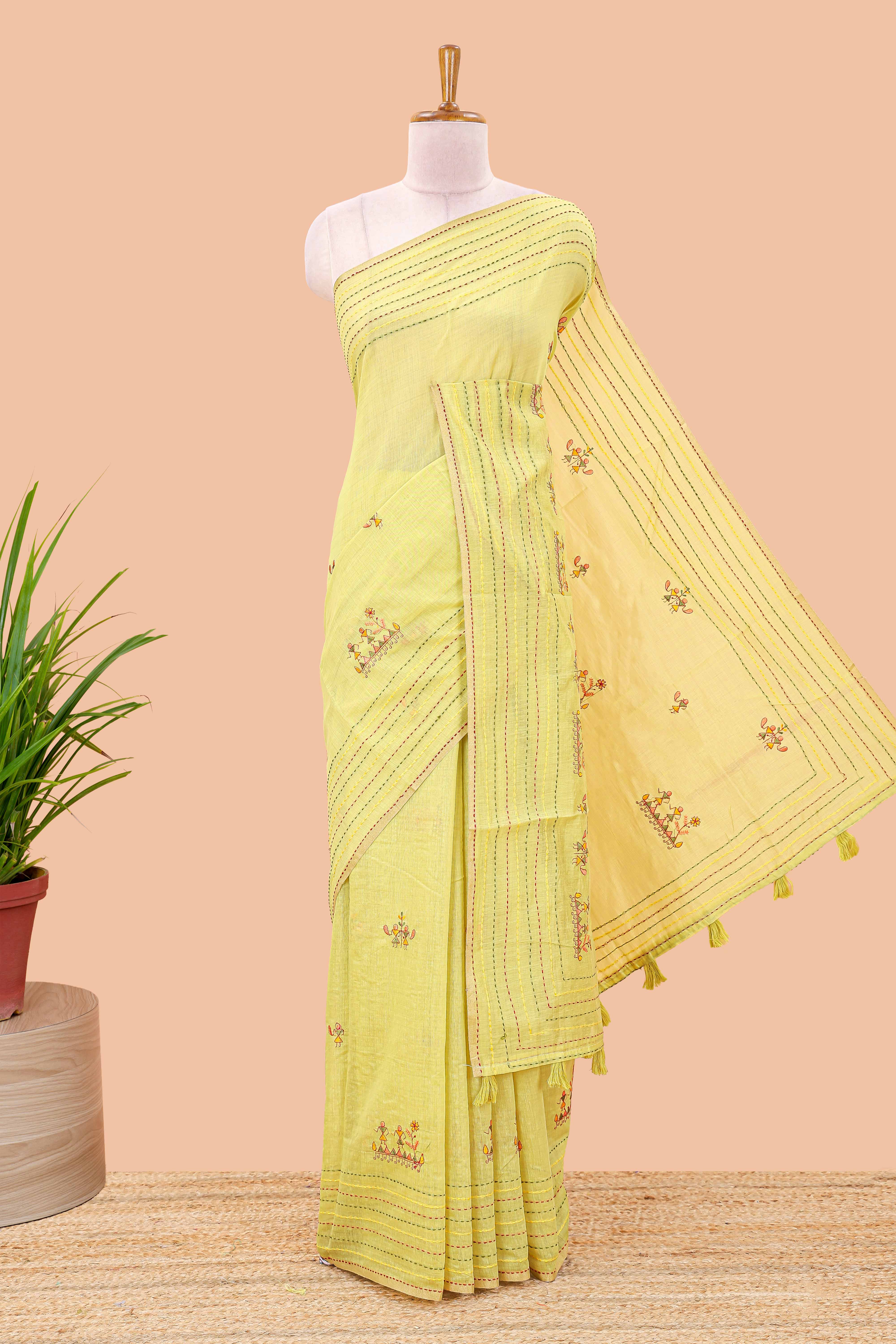 Green chanderi cotton saree with all over warli style tribal couple embroidery and hand stitched line work