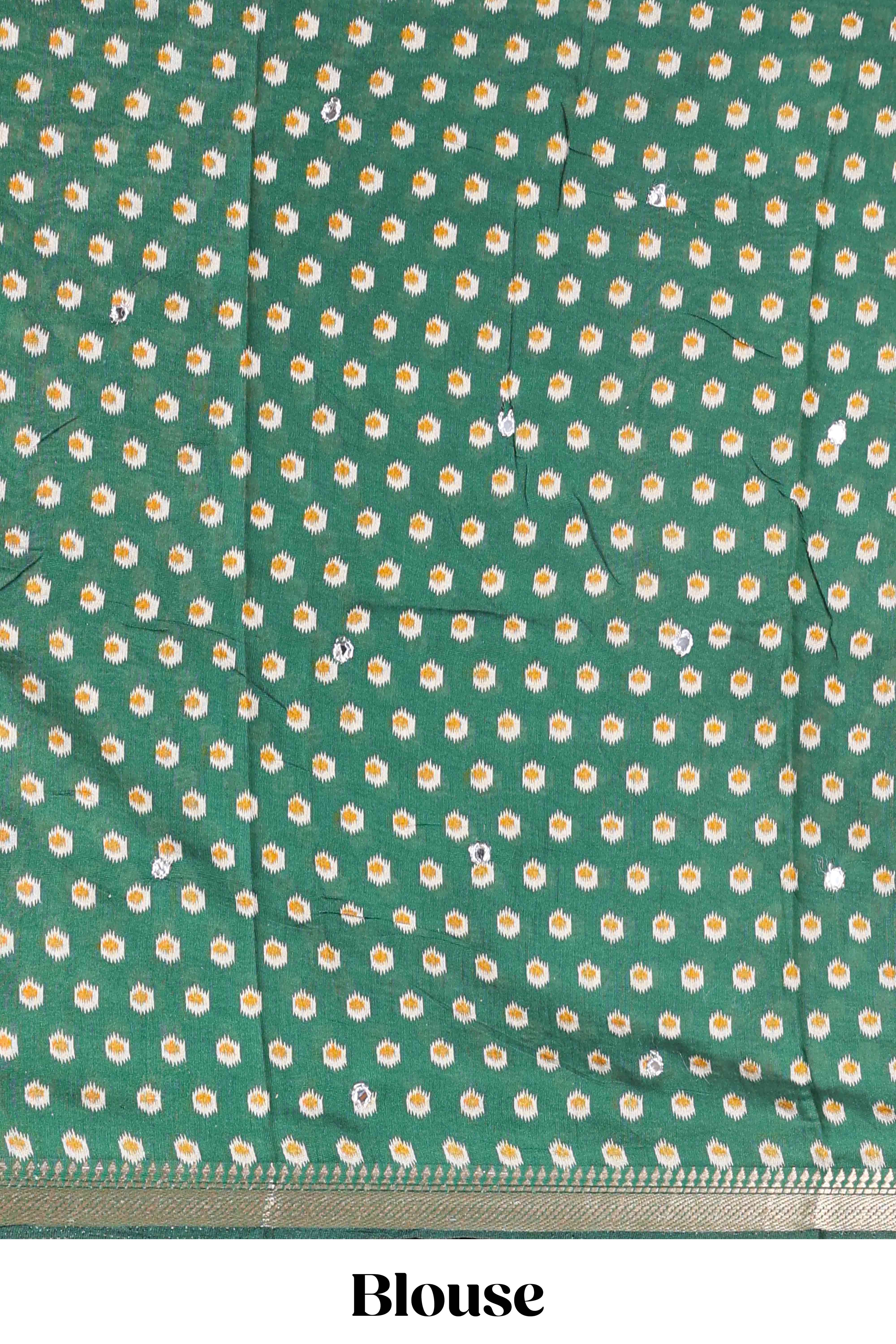 Cream chanderi cotton saree with geometric floral butta, green zari border and patola inspired mirror work