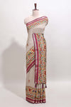 Cream chanderi cotton saree with ikkat style floral butta, pink border and patola inspired mirror work