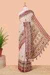 Cream chanderi cotton saree with geometric floral butta, maroon zari border and patola inspired mirror work