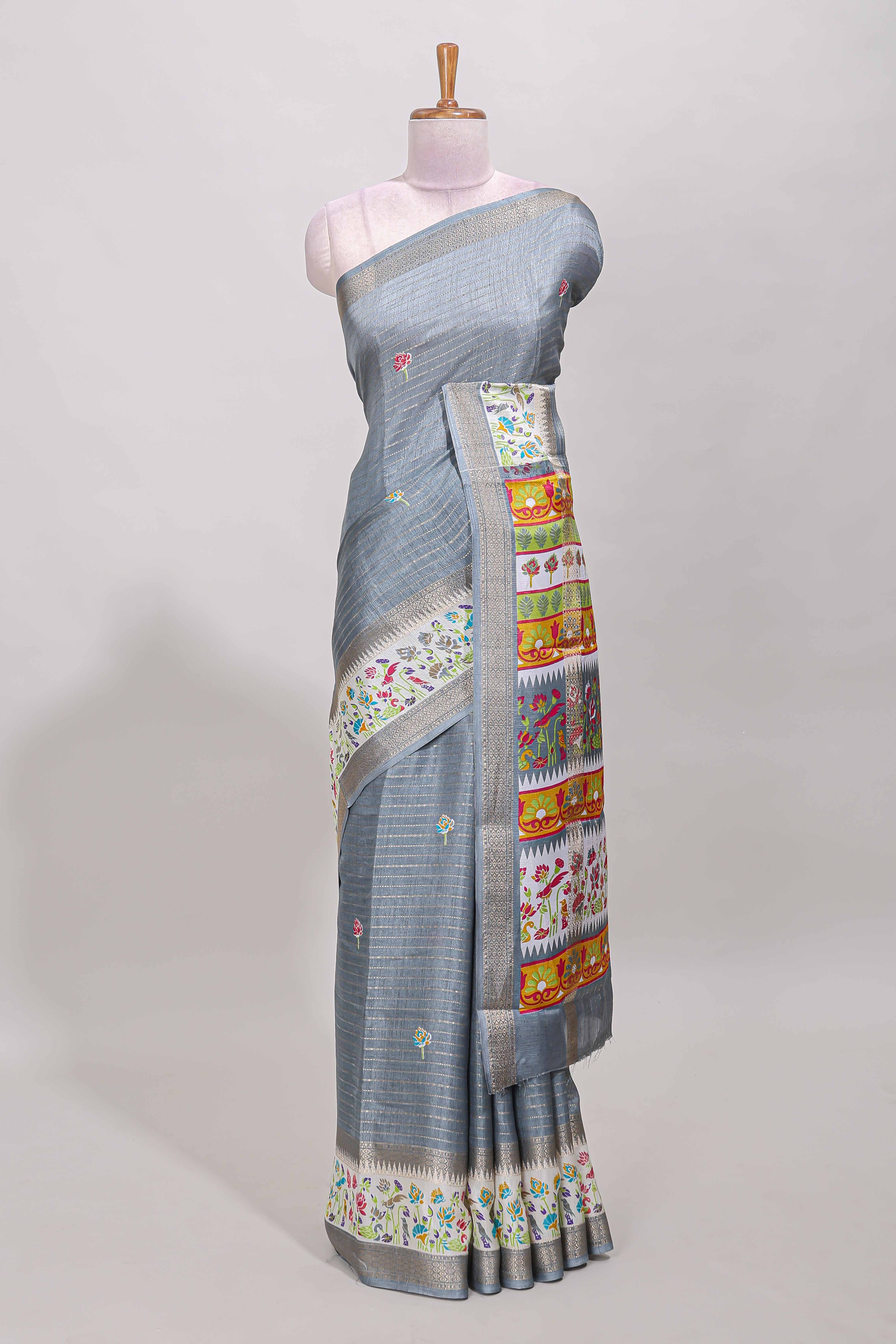 Grey dola silk saree with striped floral motifs and bird & floral bottom design with self zari border and matching blouse