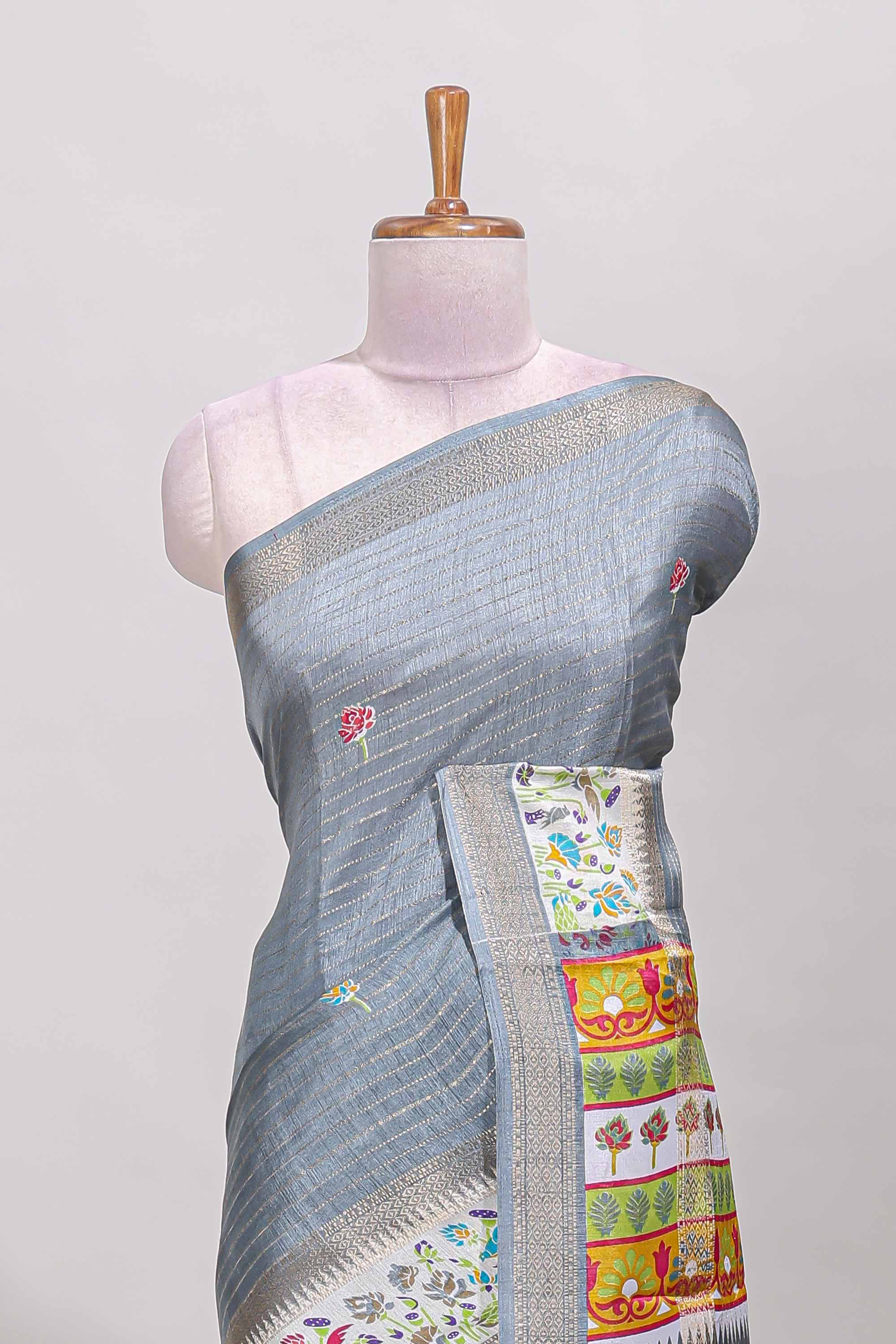 Grey dola silk saree with striped floral motifs and bird & floral bottom design with self zari border and matching blouse