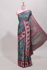 Green zari striped floral design dola silk saree with contrast zari border and printed blouse