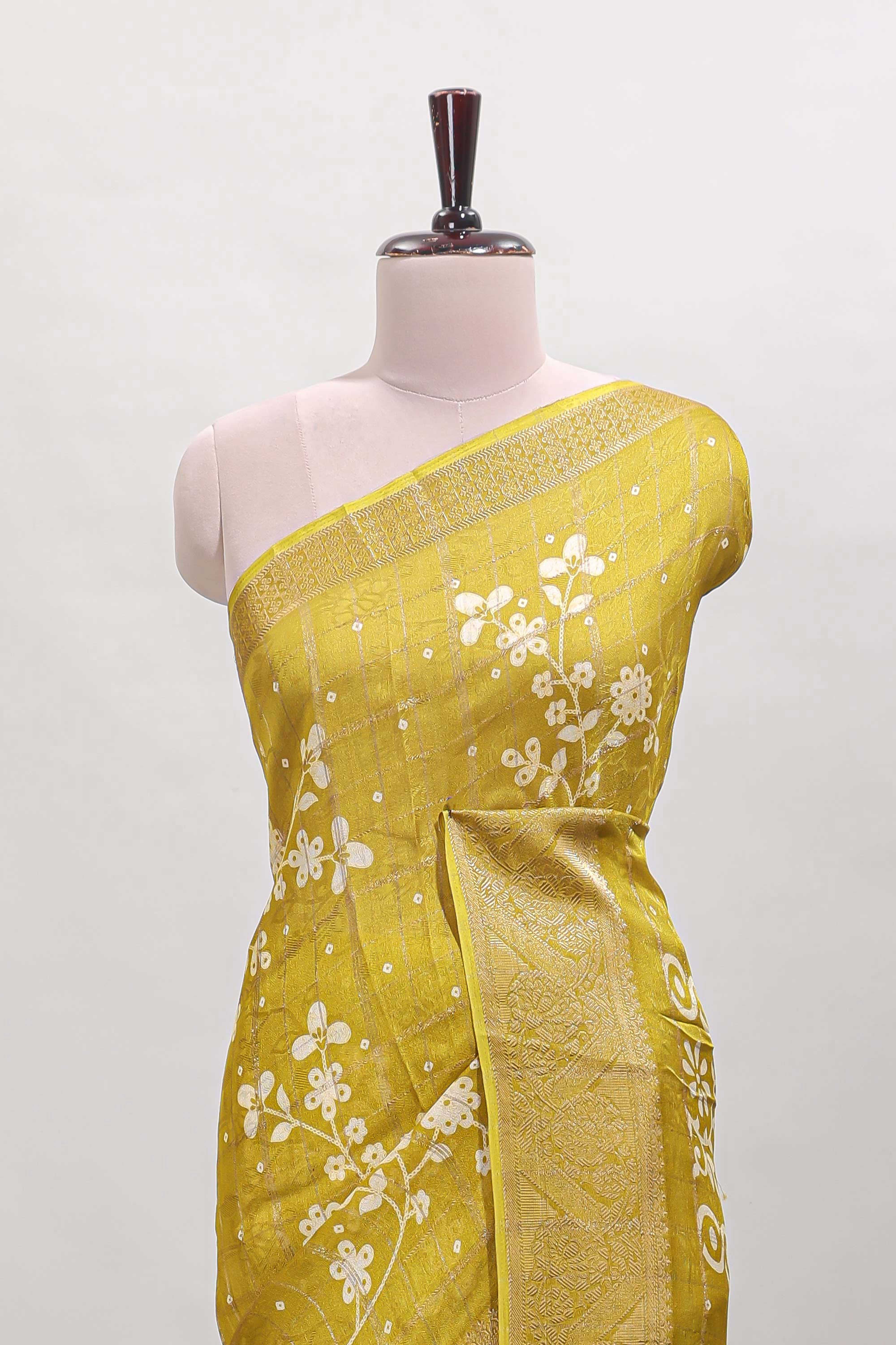 Mustard checked floral design dola saree with self zari border and matching blouse