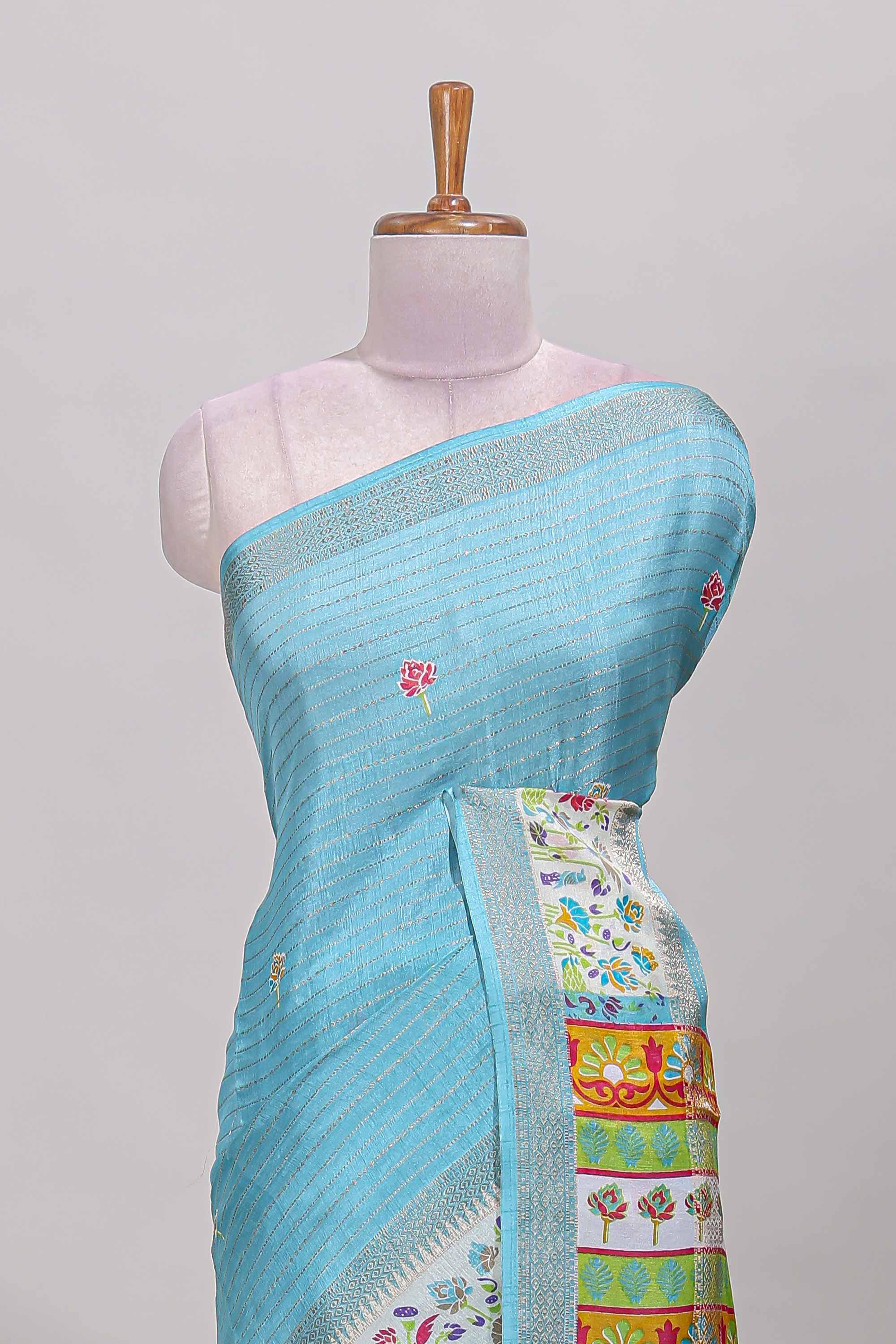 Blue dola silk saree with striped floral motifs and bird & floral bottom design with self zari border and matching blouse