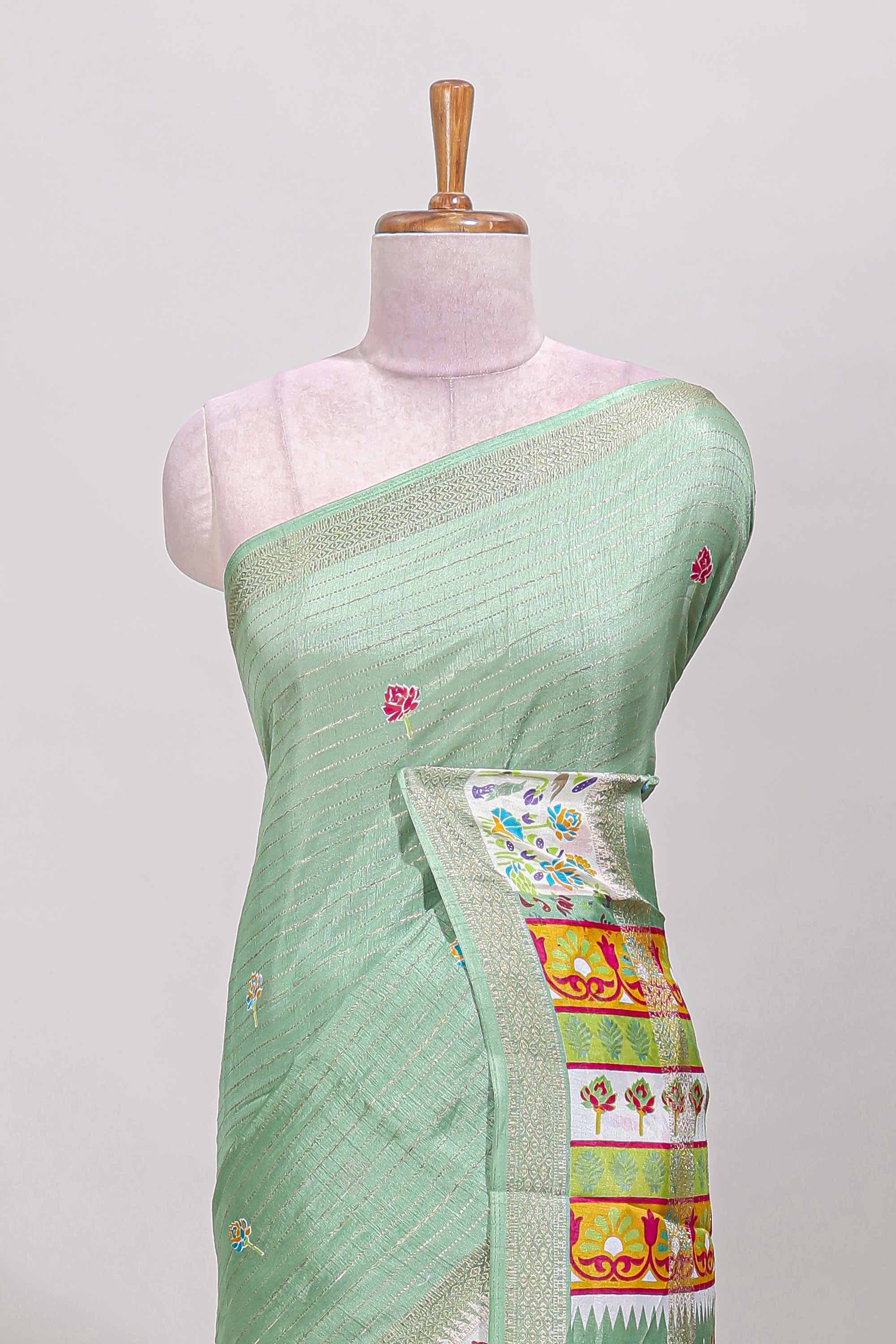Green dola silk saree with striped floral motifs and bird & floral bottom design with self zari border and matching blouse