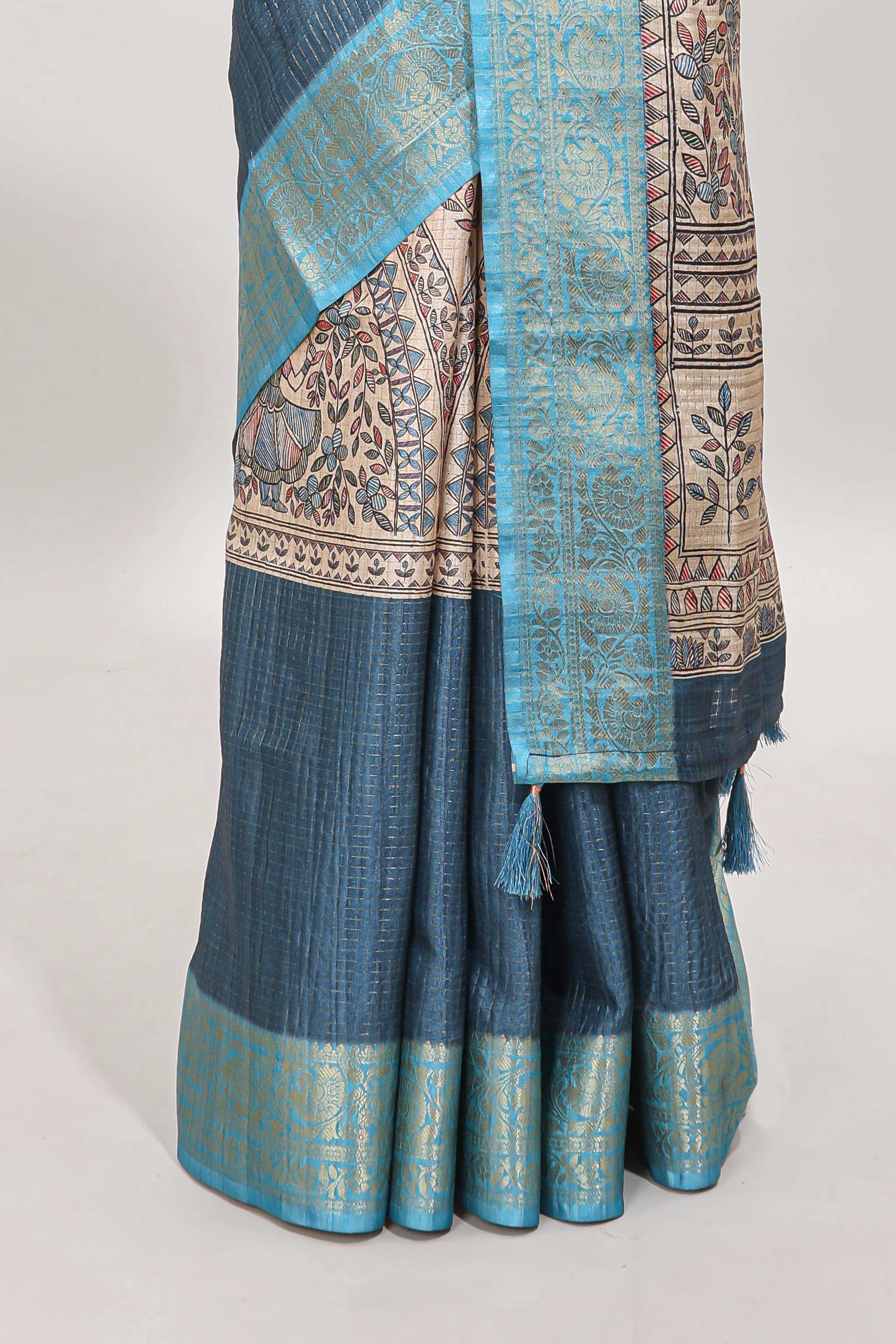 Blue ditsy floral print art tussar saree with contrast zari border and matching blouse