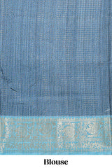 Blue ditsy floral print art tussar saree with contrast zari border and matching blouse
