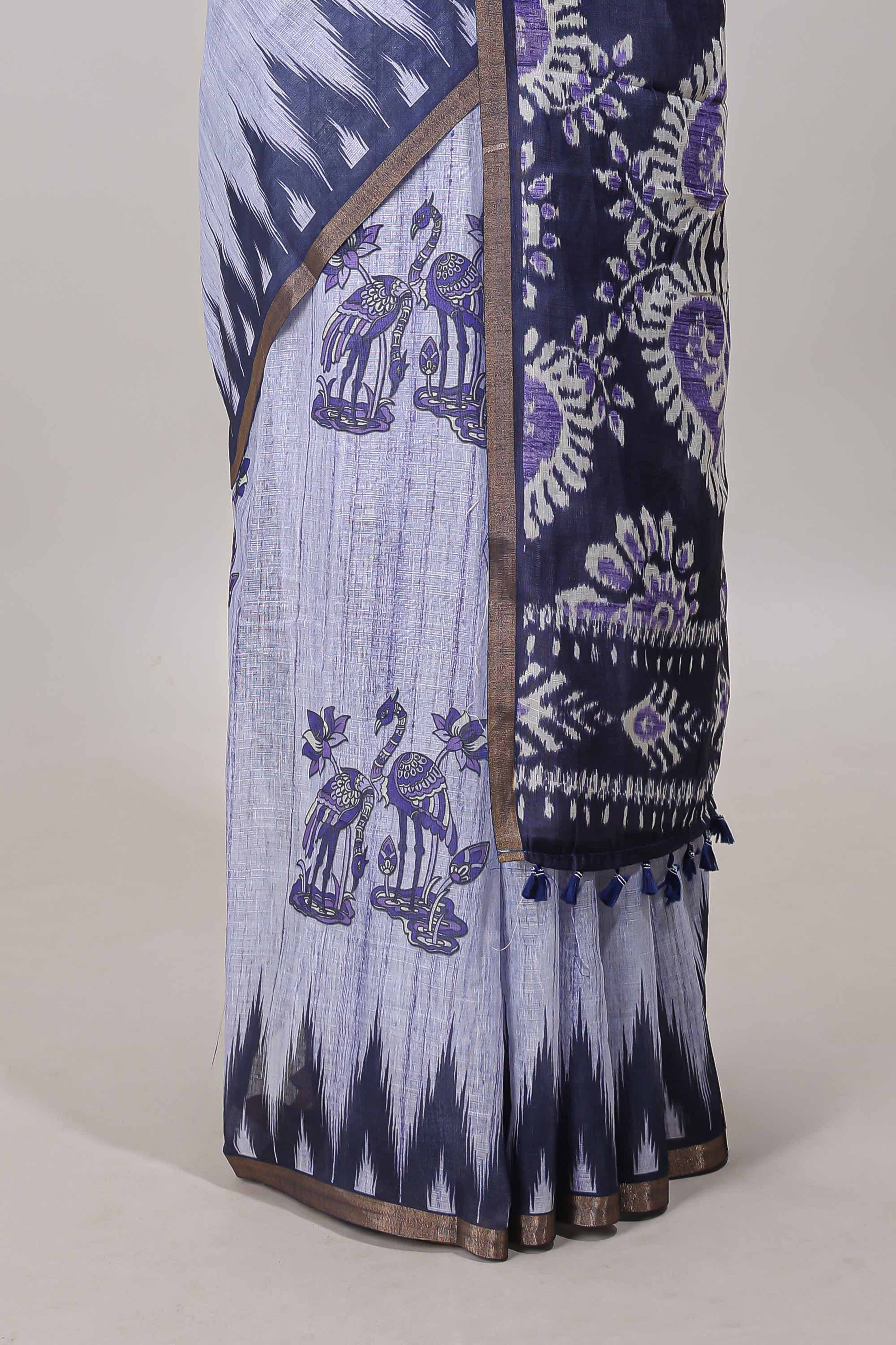 Lavender lotus and crane birds motis linen cotton saree with ikkat style self zari border and pallu