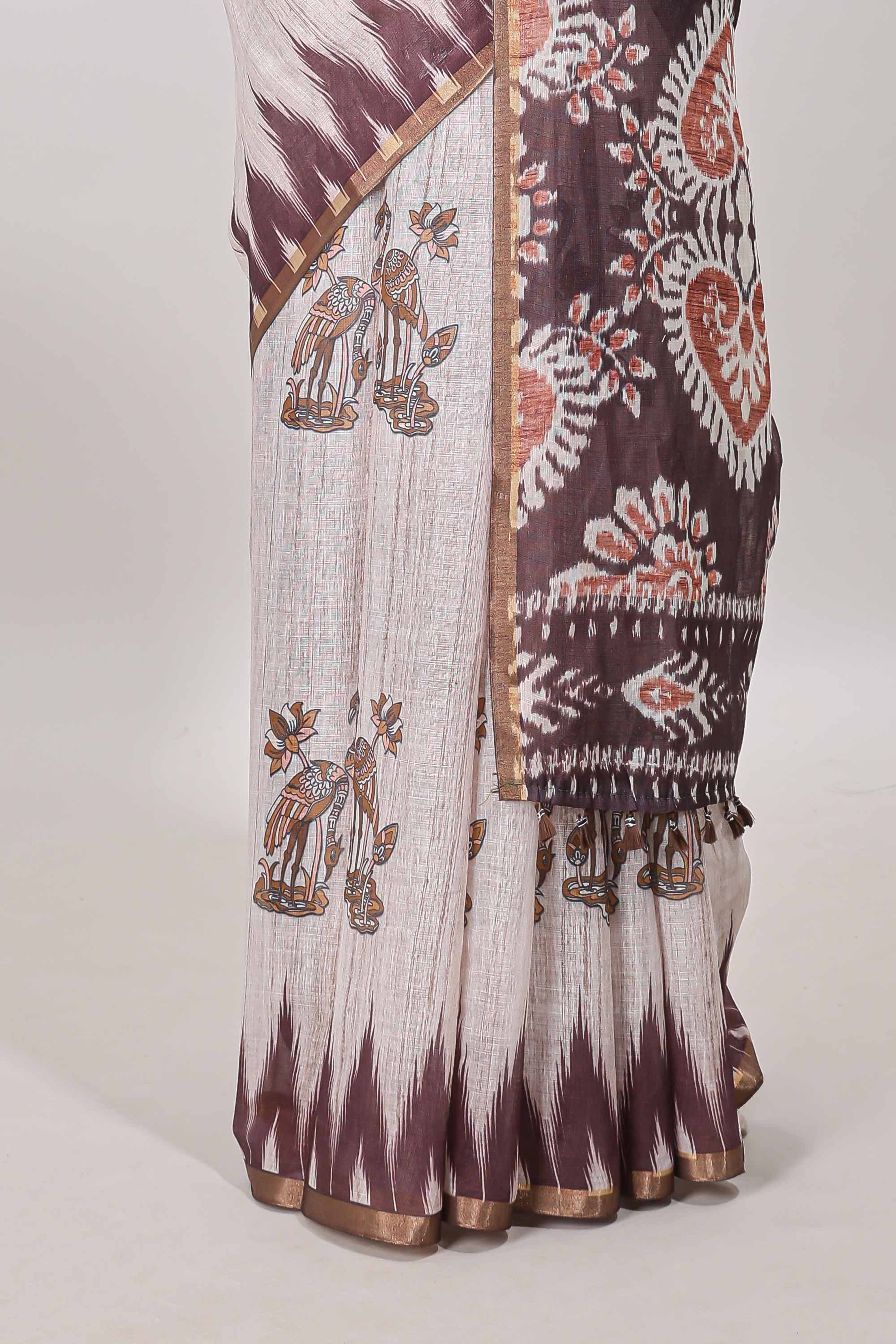 Brown lotus and crane birds motis linen cotton saree with ikkat style self zari border and pallu