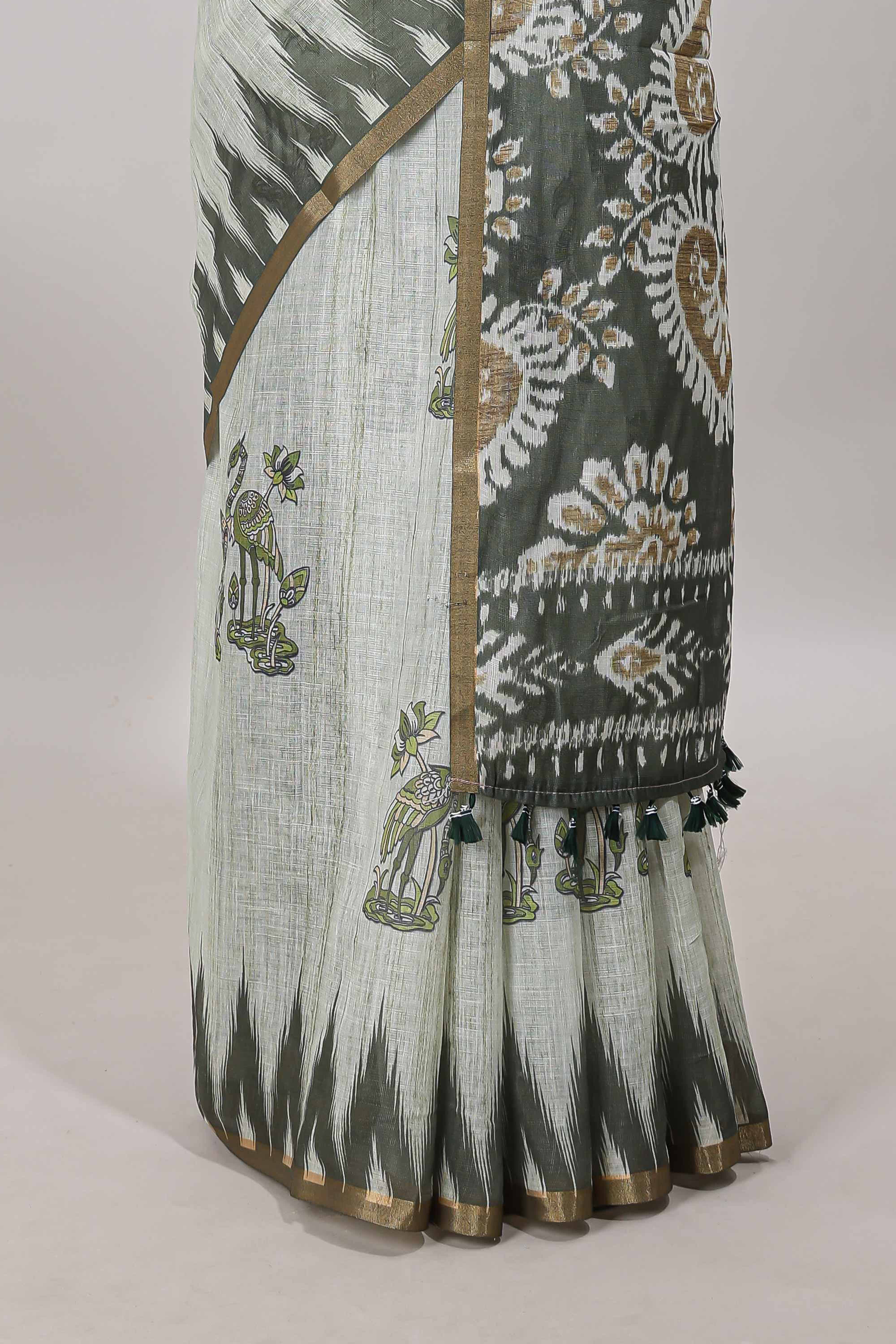 Green lotus and crane birds motis linen cotton saree with ikkat style self zari border and pallu