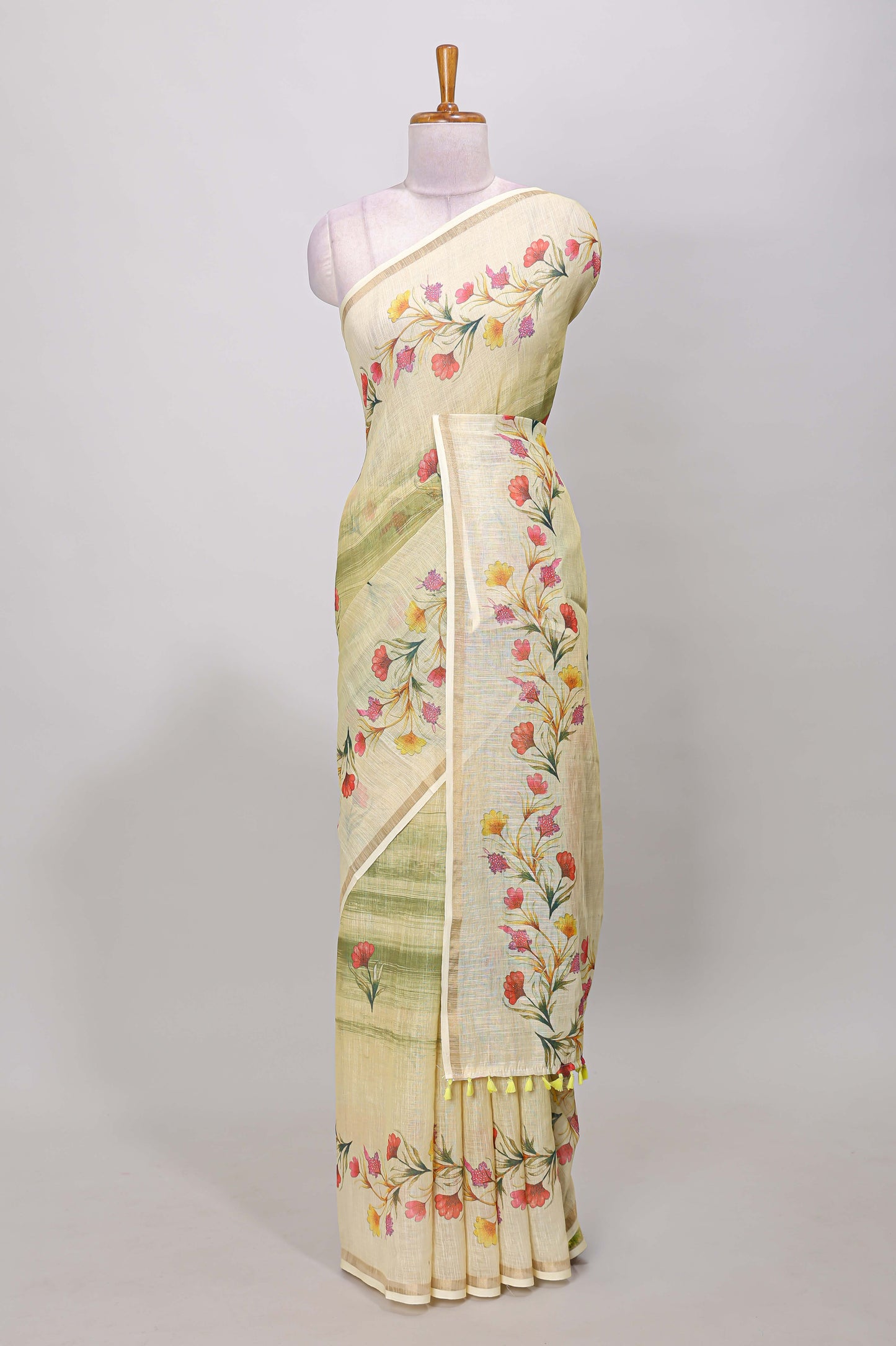 Green linen cotton saree with floral vines print, zari border and printed blouse