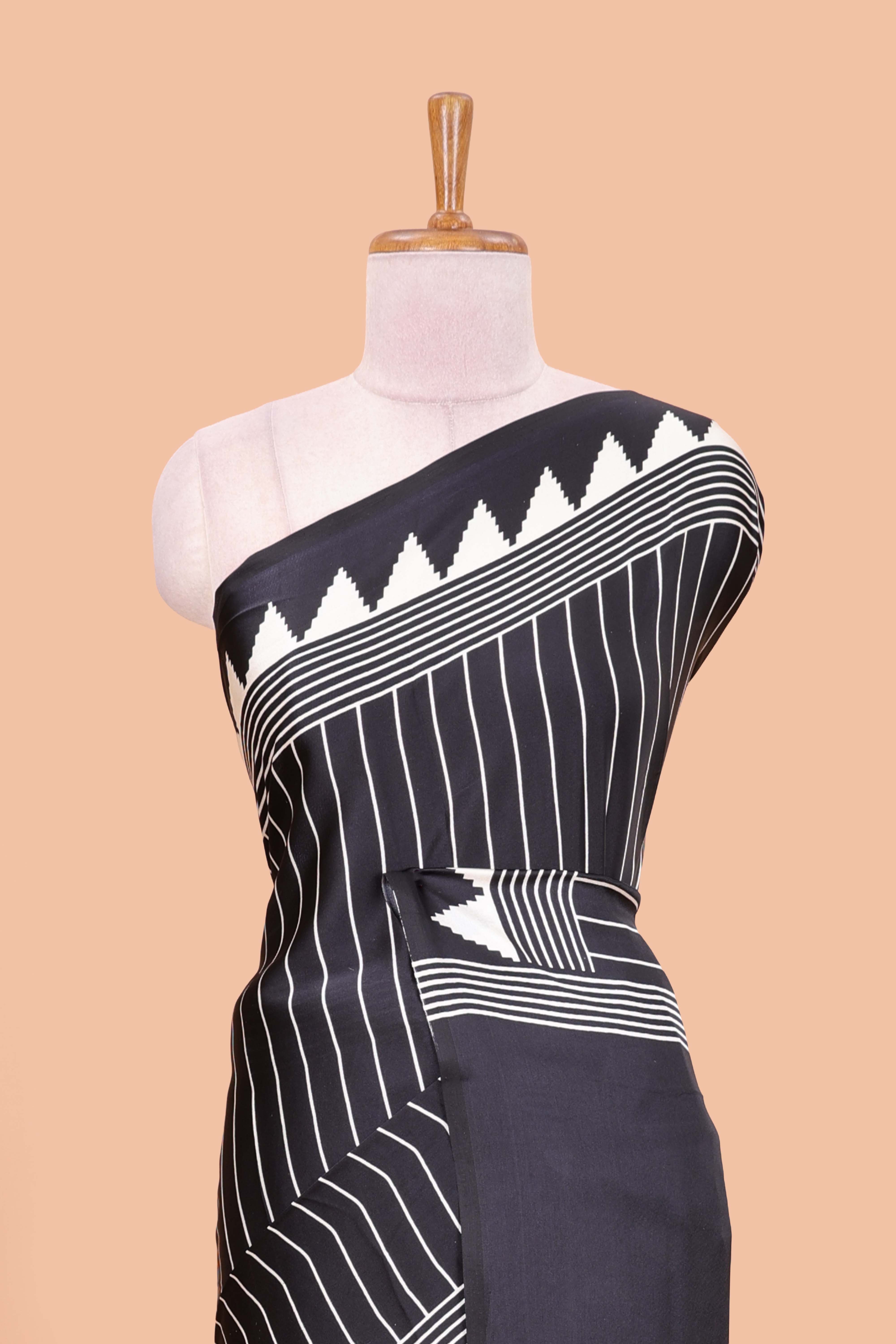 Black satin ajrakh modal printed saree with striped body and geometric print border and pallu