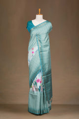Teal Blue Art Tussar Saree Centre Floral Print Across The Body With Zari Stripes Pallu
