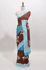 Chocolate brown and blue dual shade floral motifs mul mul cotton saree with self border and matching blouse