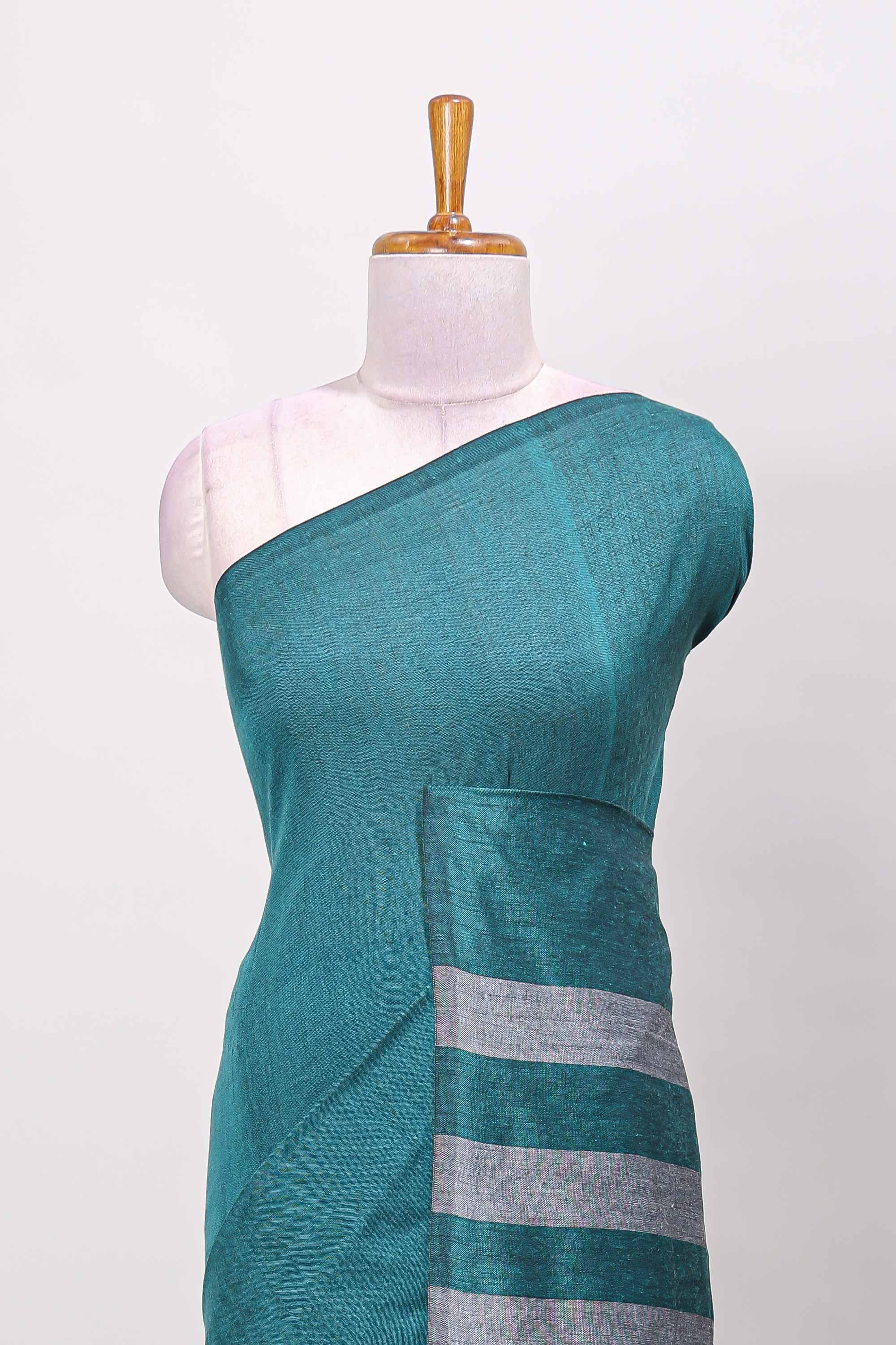 Borderless green plain south cotton saree with contrast striped pallu and matching blouse
