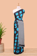Black satin modal saree with blue polka print, contrast checked pallu, and printed blouse