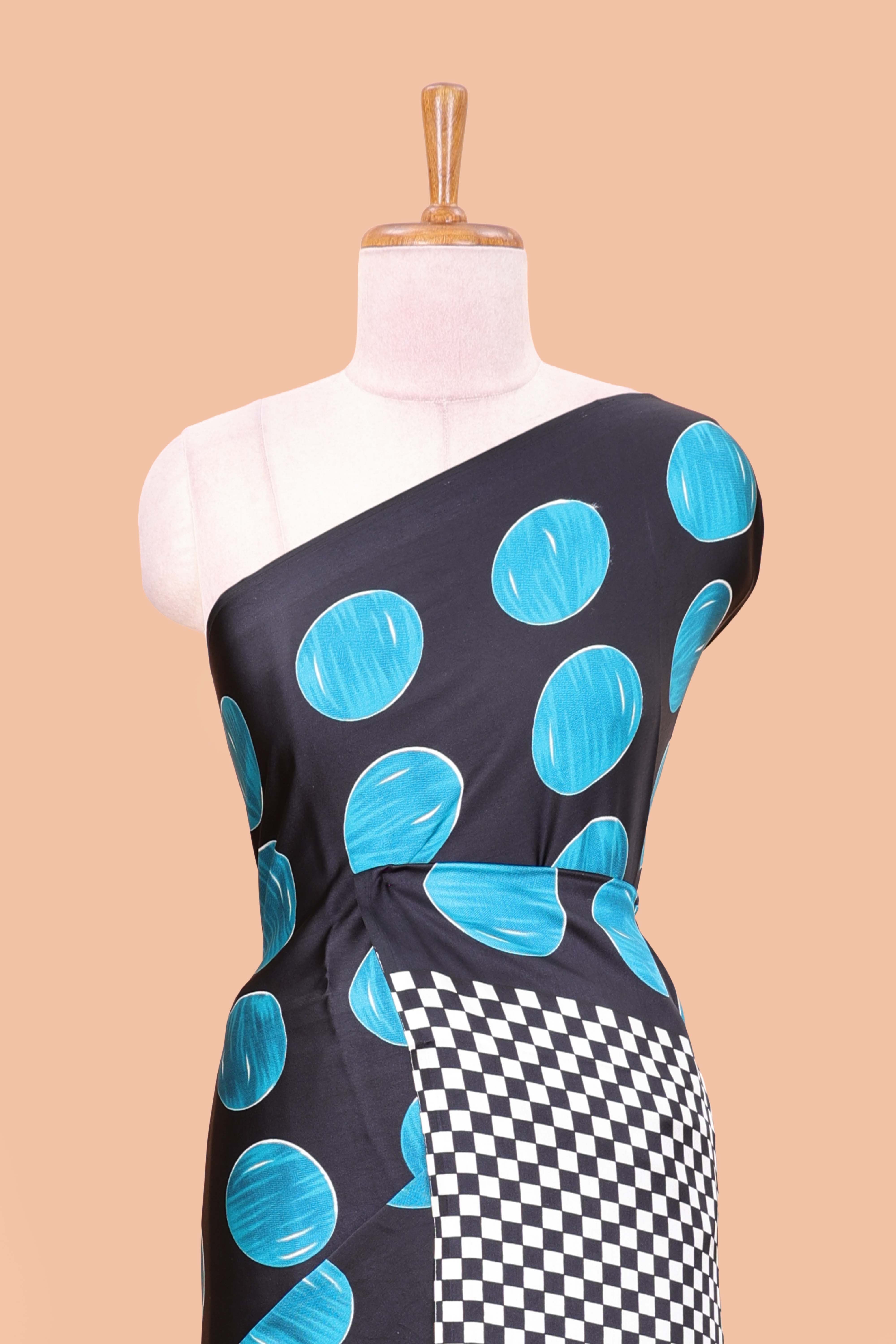 Black satin modal saree with blue polka print, contrast checked pallu, and printed blouse