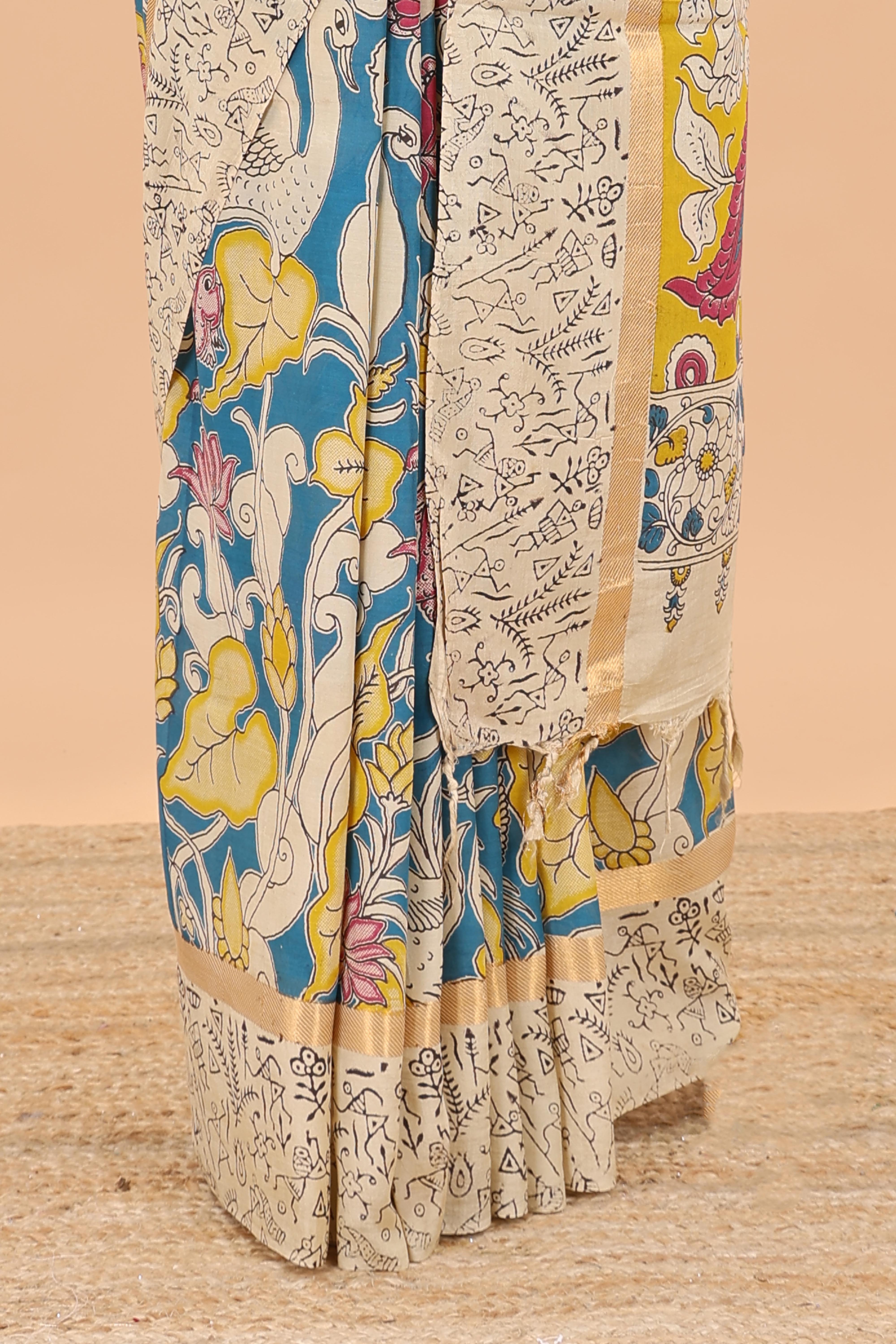 Peacock green kalamkari cotton saree with traditional floral motifs and contrast pallu