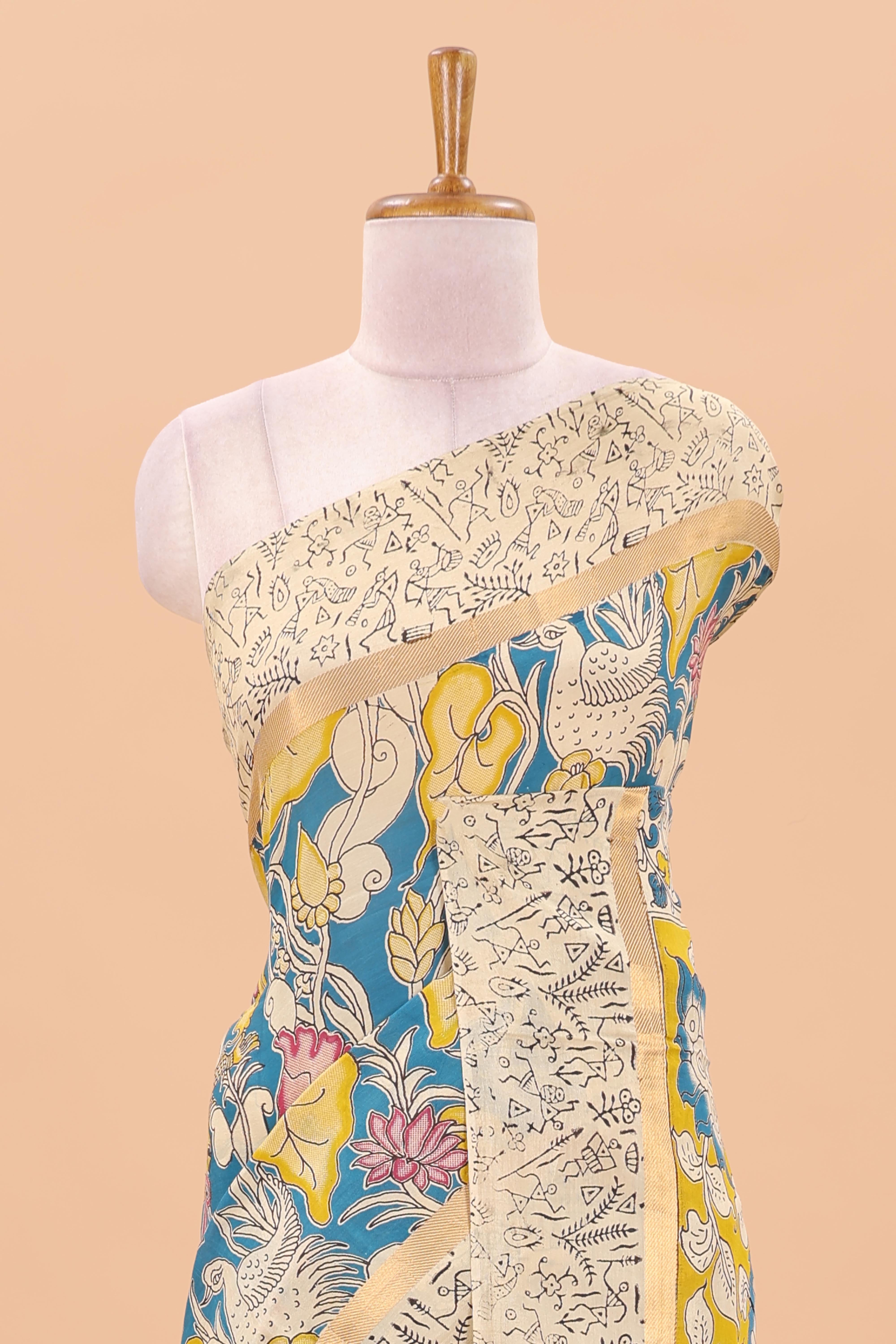 Peacock green kalamkari cotton saree with traditional floral motifs and contrast pallu