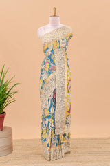 Peacock green kalamkari cotton saree with traditional floral motifs and contrast pallu