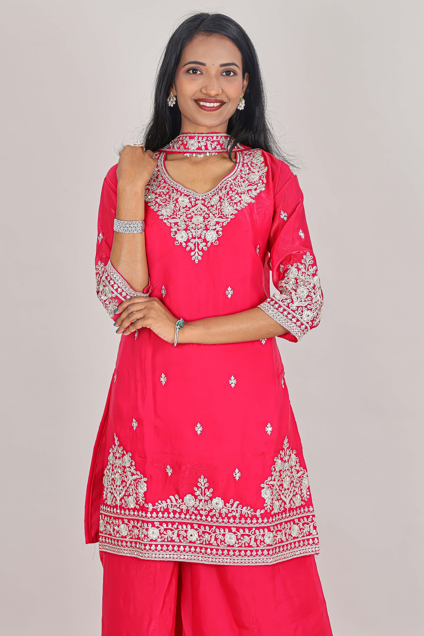 Pink floral butta stone work embroidered sharara set with 3/4 sleeves, U-neck matching bottom and dupatta