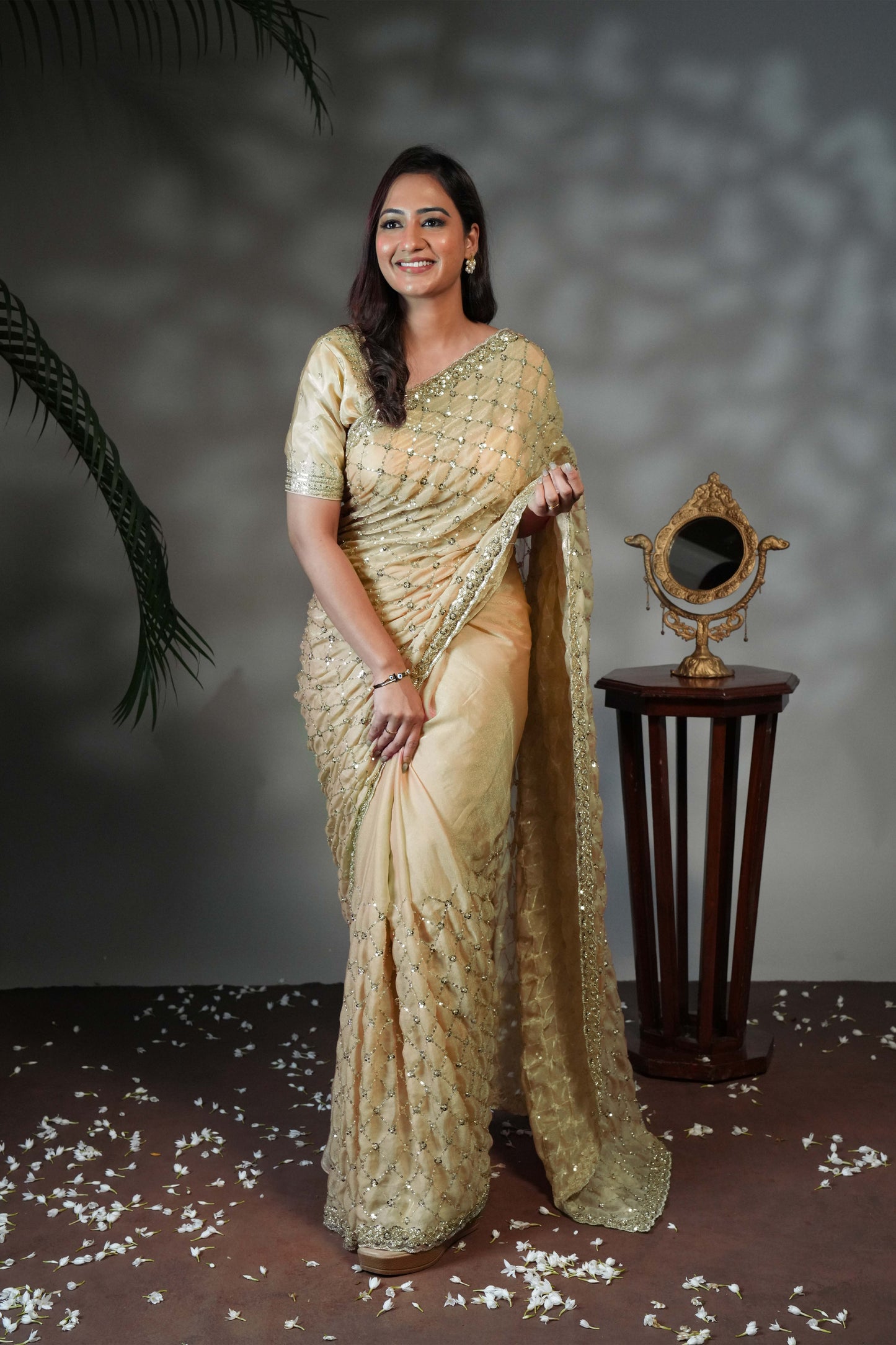 Green geometric pattern stone work all over body designer saree with scallop design border matching blouse