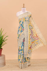 Peacock green kalamkari cotton saree with traditional floral motifs and contrast pallu
