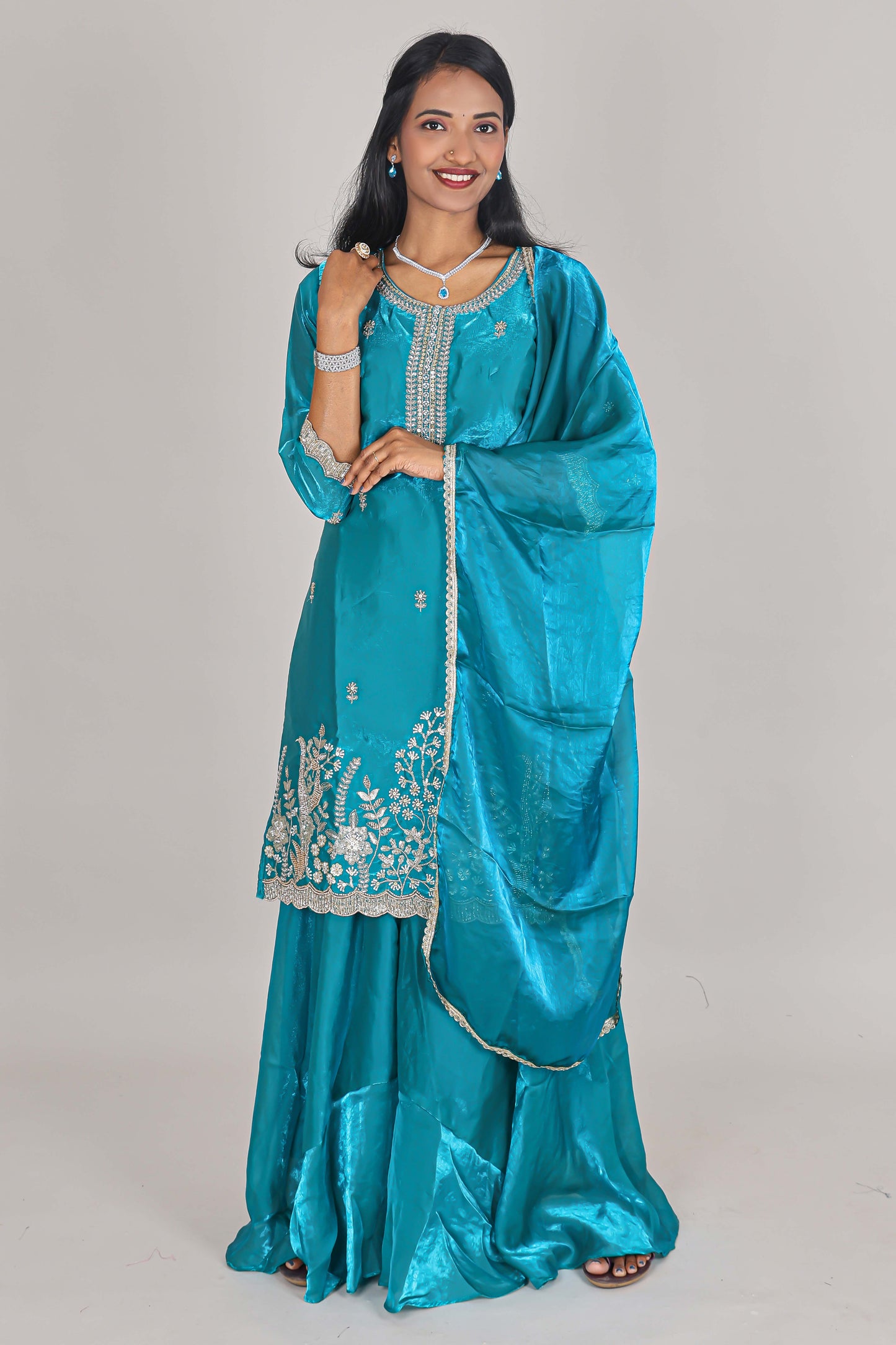 Turquiose green floral butta stone work embroidered sharara set with 3/4 sleeves, U-neck matching bottom and dupatta