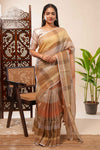 Brown Tones semi tussarall over saree Subtle Stripe and Checked pattern along with Tassels and Contrast Blouse