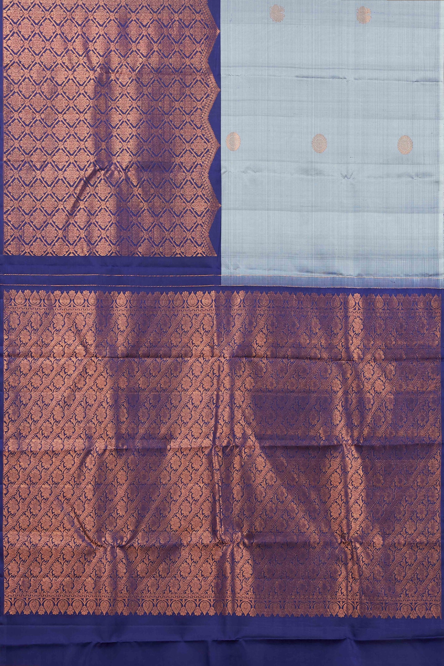 Kanchipuram Traditional Silk Saree in Light Blue with Gold Zari Buttas and Contrast Purple Long Border.