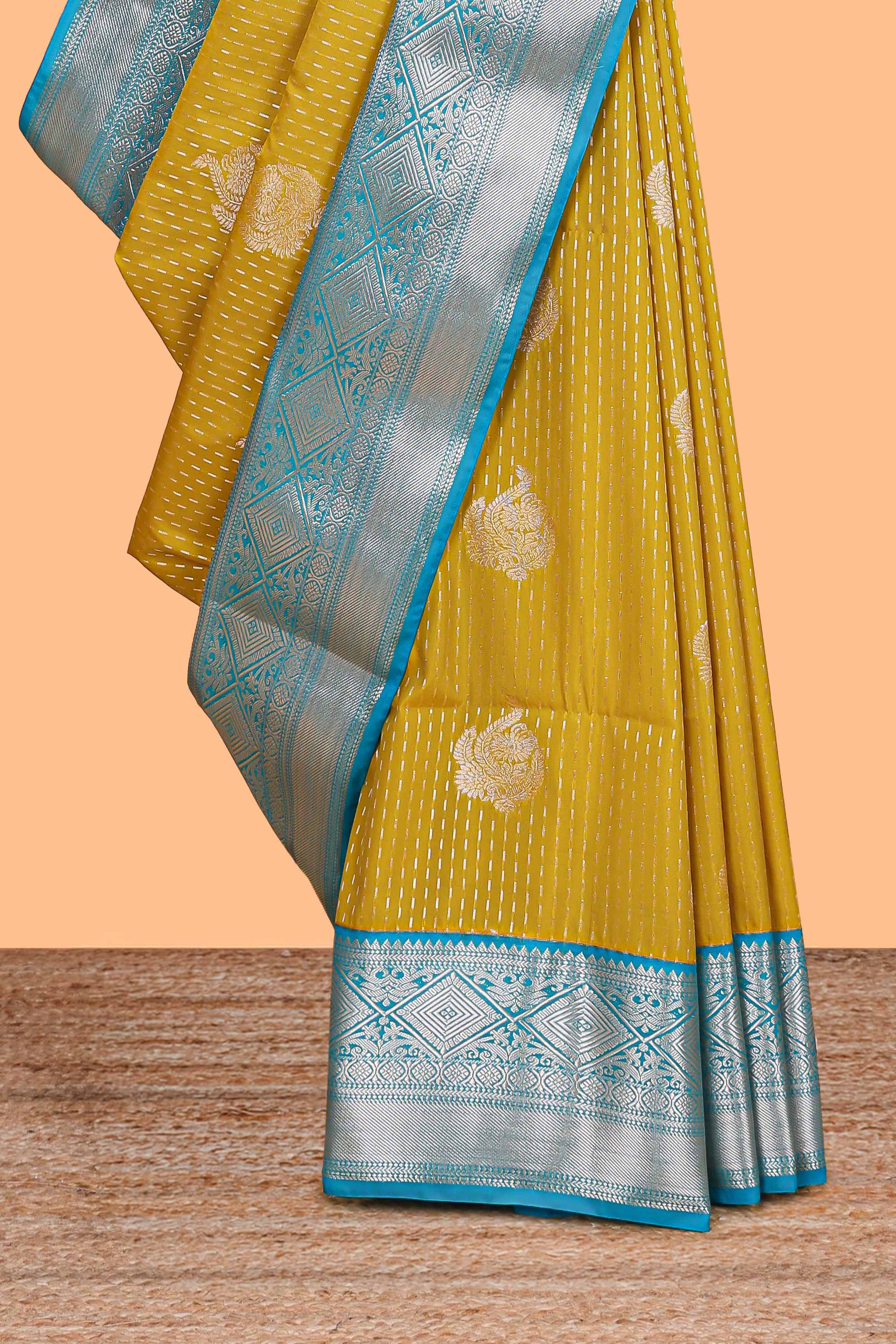 Mustard zari butta design semi soft silk saree with contrast border and pallu