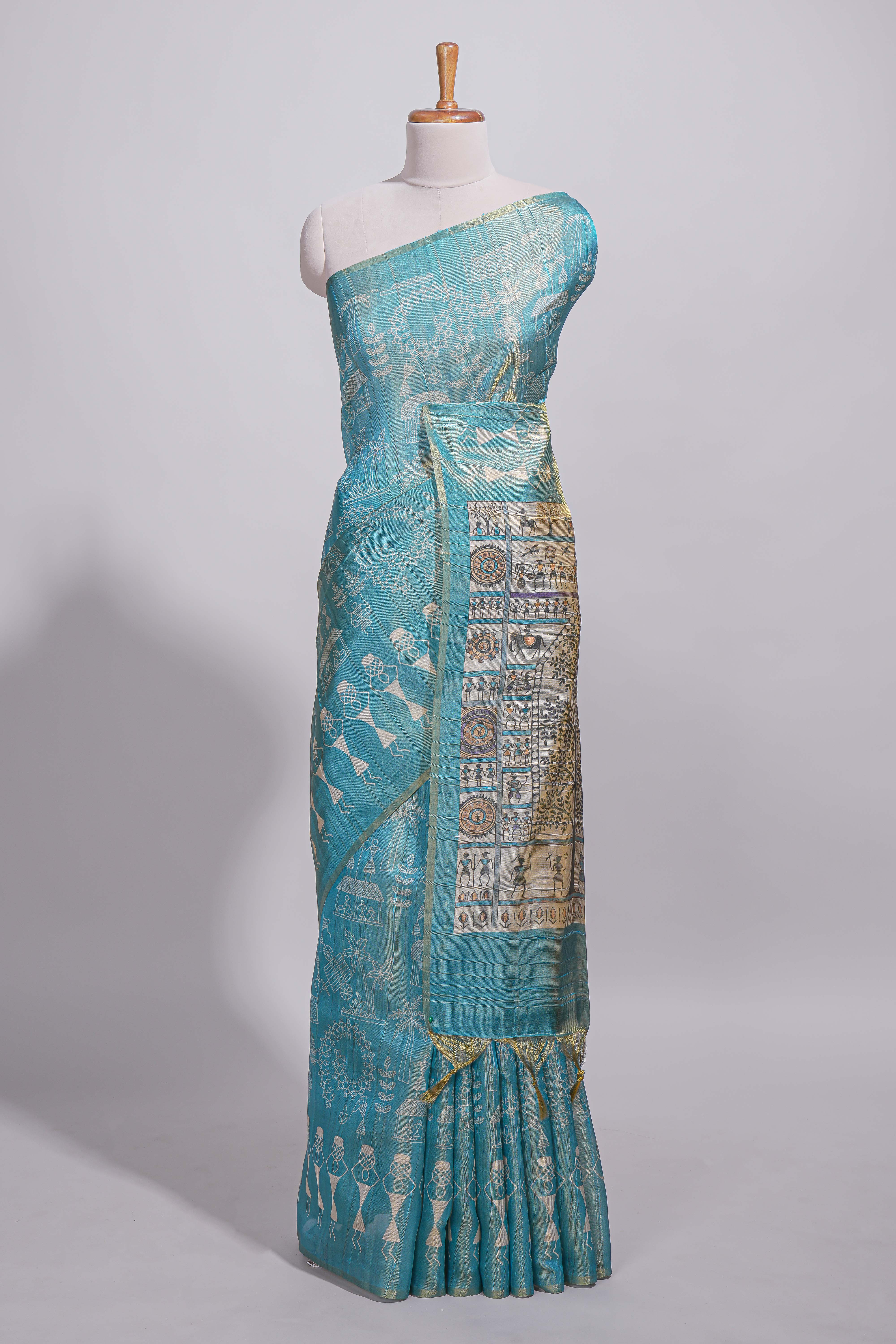 Teal green warli printed semi tussar sareewith contrast warli printed pallu and matching blouse