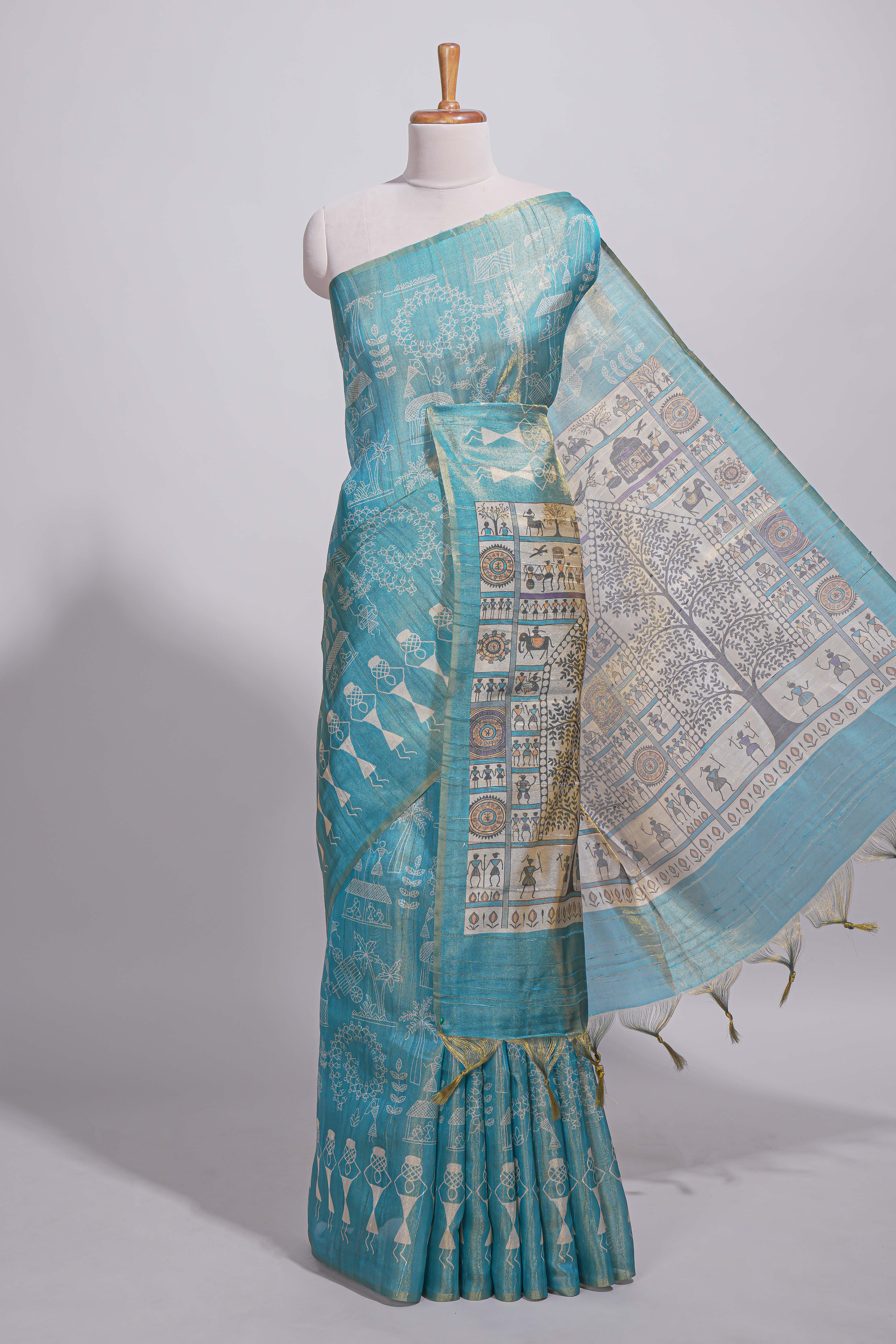 Teal green warli printed semi tussar sareewith contrast warli printed pallu and matching blouse