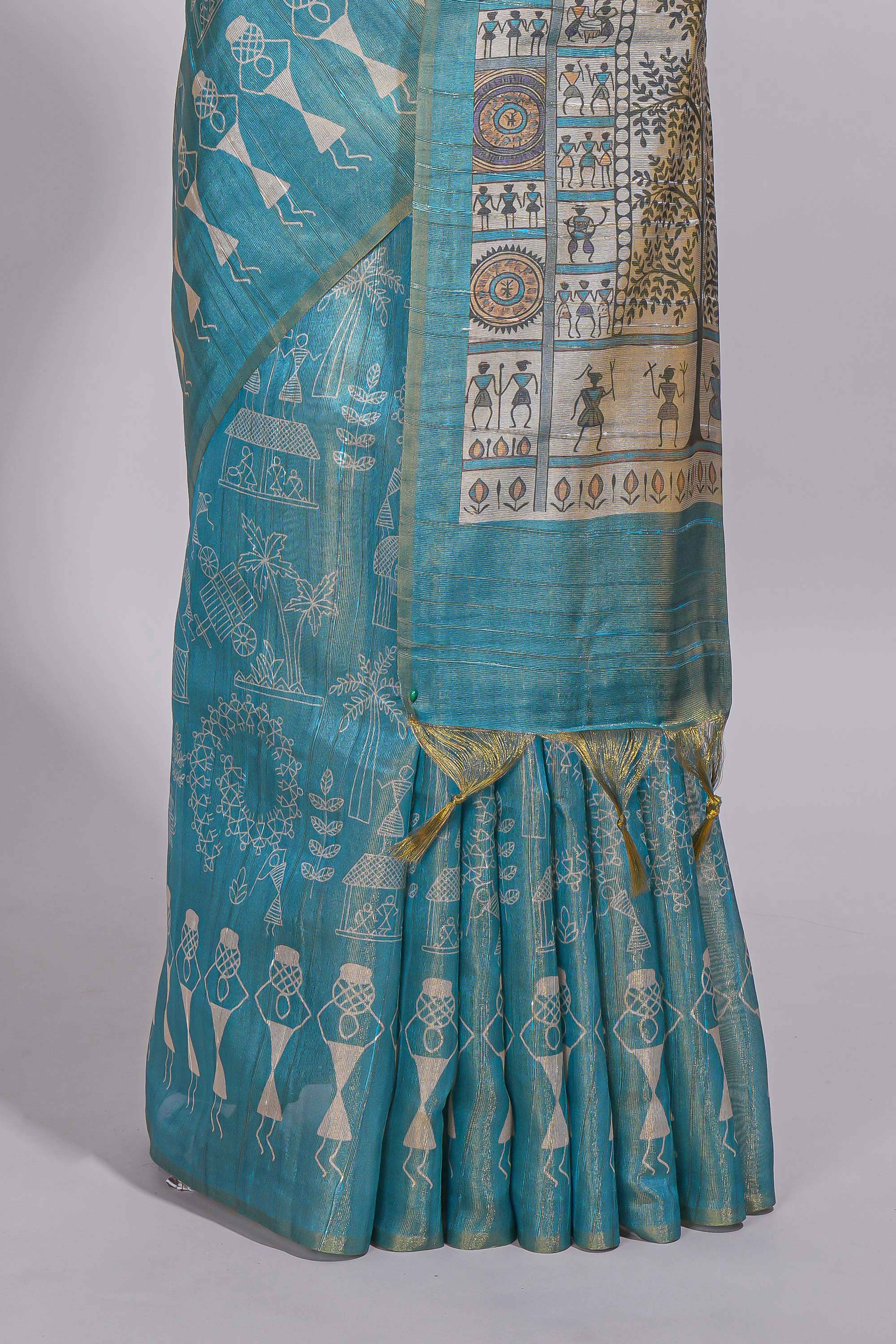 Teal green warli printed semi tussar sareewith contrast warli printed pallu and matching blouse