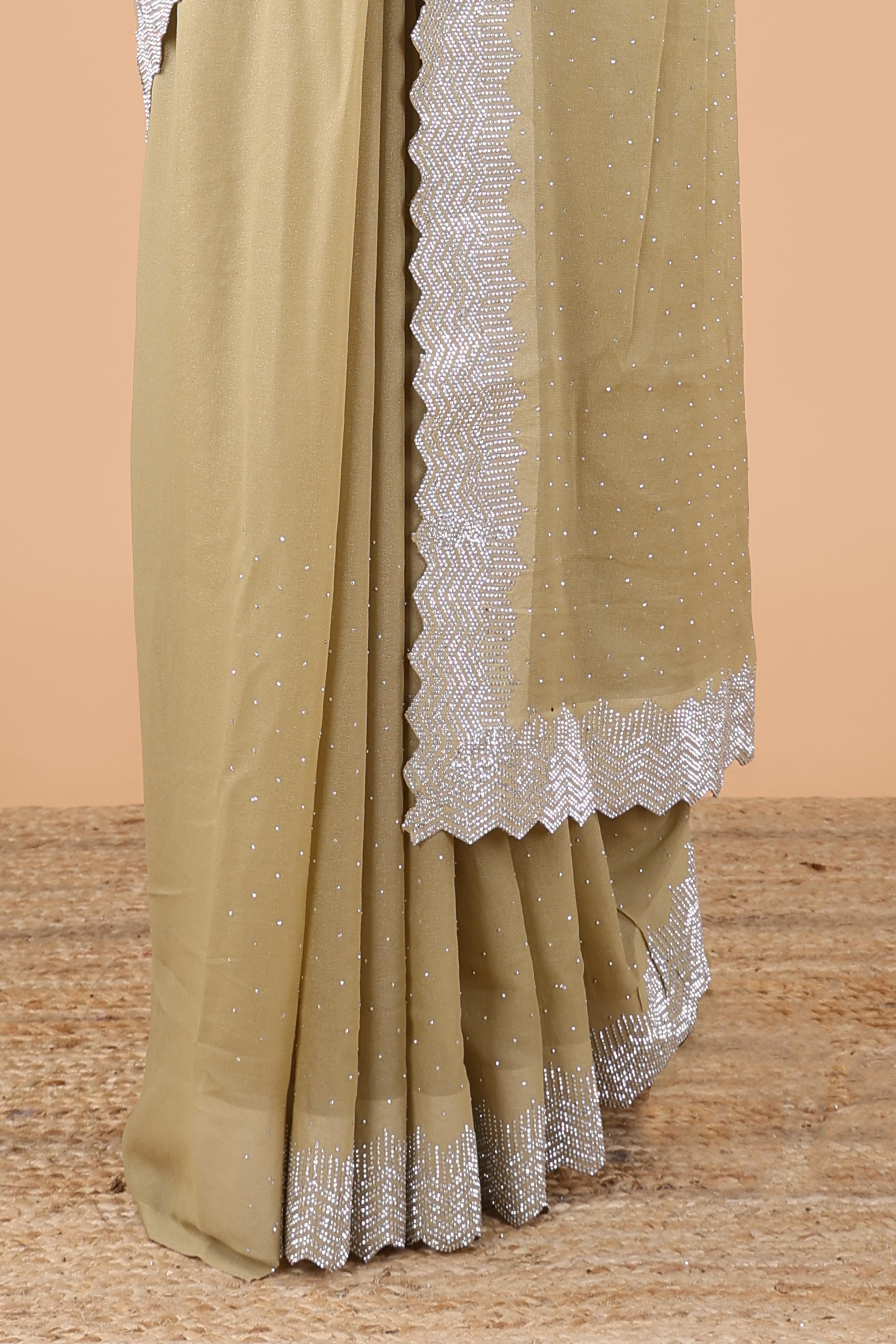 Green designer georgette space silk saree with heavy stone & beads work, short pallu and contrast sequin embroidered blouse