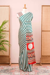 White Modal Silk Saree Detailing Vertical Green Stripes That Add a Sleek and Elegant Touch. Highlighted Contrast Ajrakh Print Pallu Along With Blouse