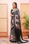 Black Modal Silk SareeThe Body Has Fine Vertical White StripesThe Border Are Highlighted Pichwai Design Contrast Coin Motifs In PalluAlong With AjrakhPrinted Blouse