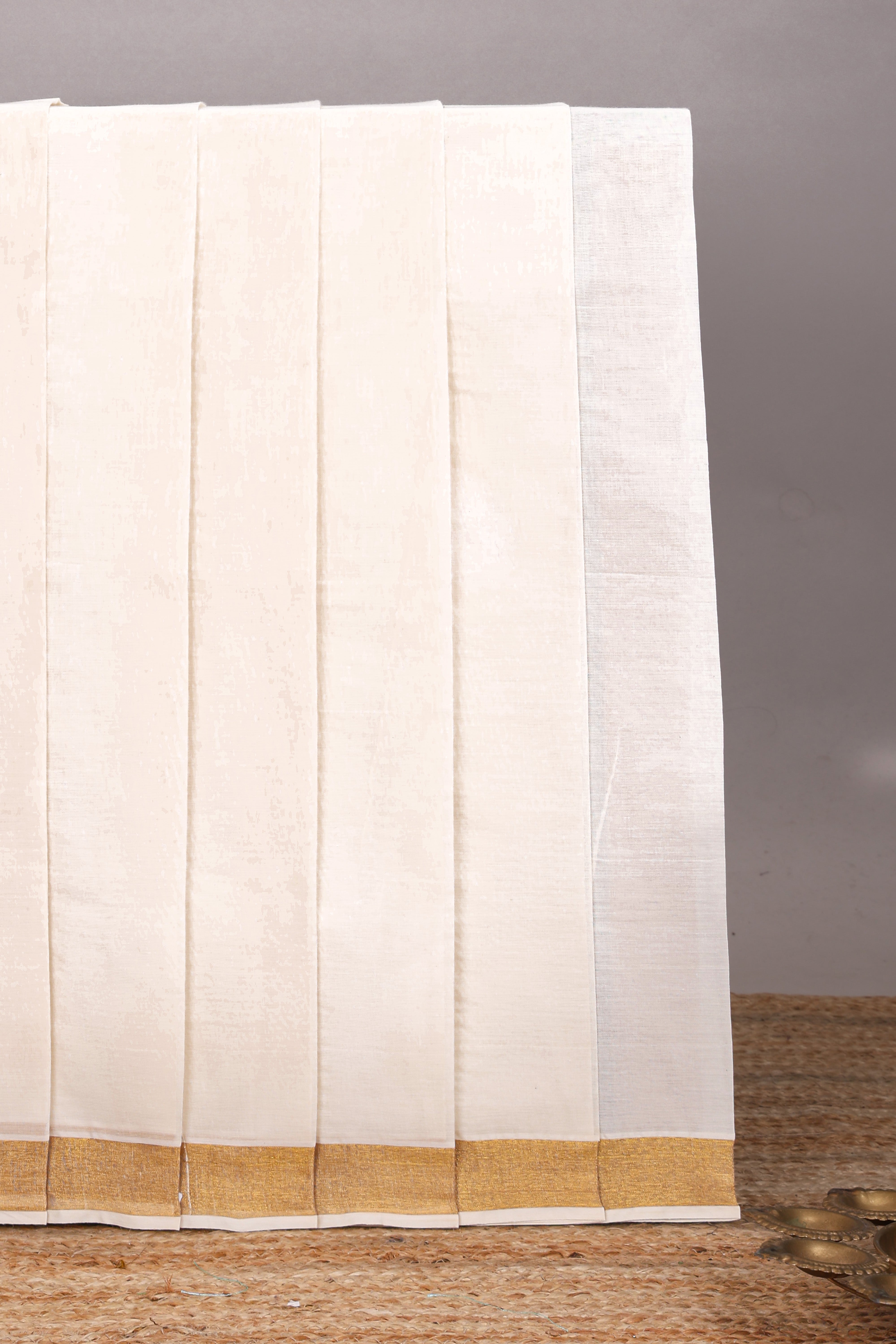Cream peacock feather motifs design kerala cotton saree with self zari border and krishnan themed pallu