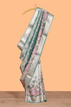 Green floral motifs design art tissue saree with self zari border and matching blouse