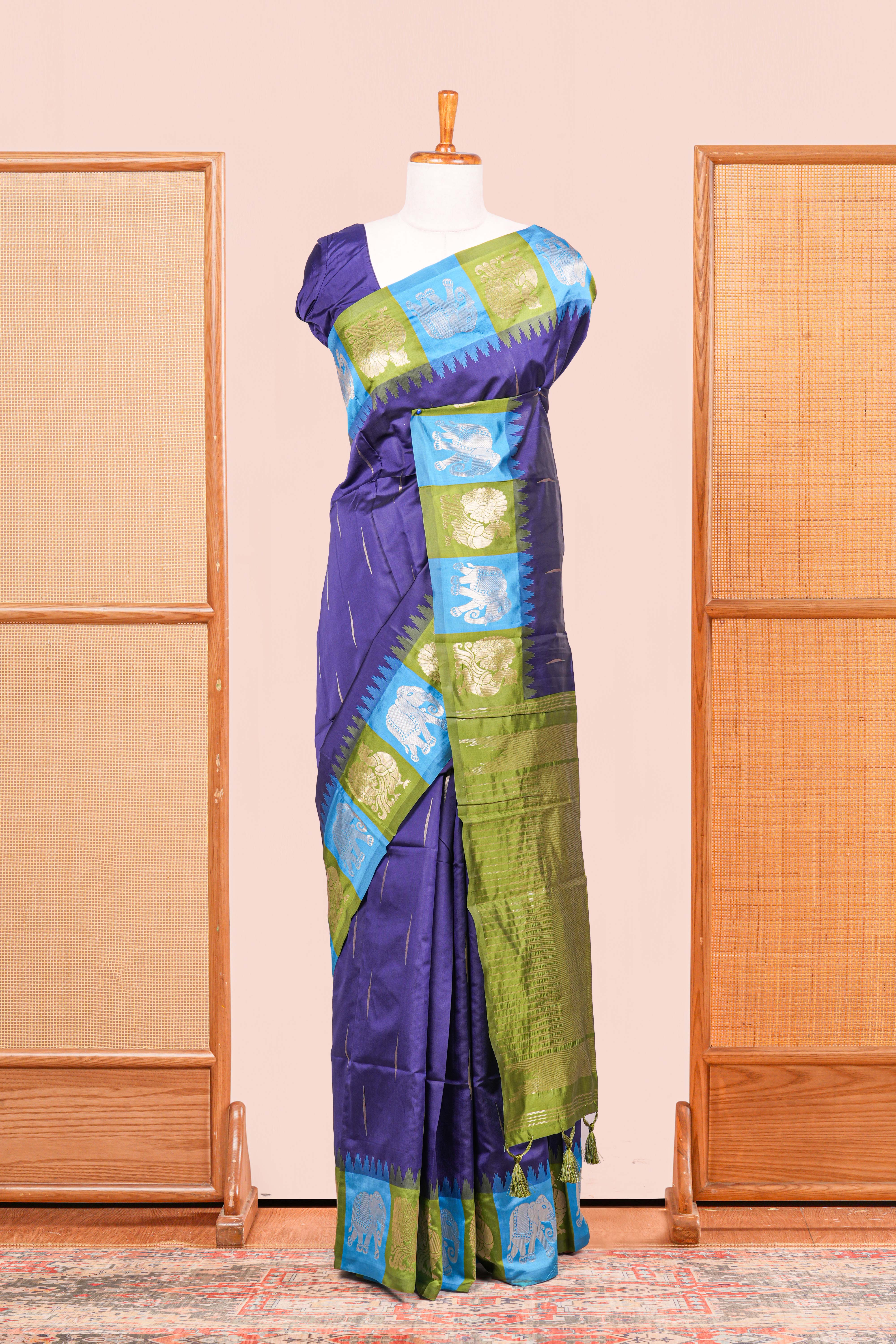 Navy Blue Semi Art Silk Saree Detailing Zari Butta And Border Are Highlight Contrast Color With IntricateZari Woven Elephant, Peacock Motifs With Golden Zari Weaving Pallu