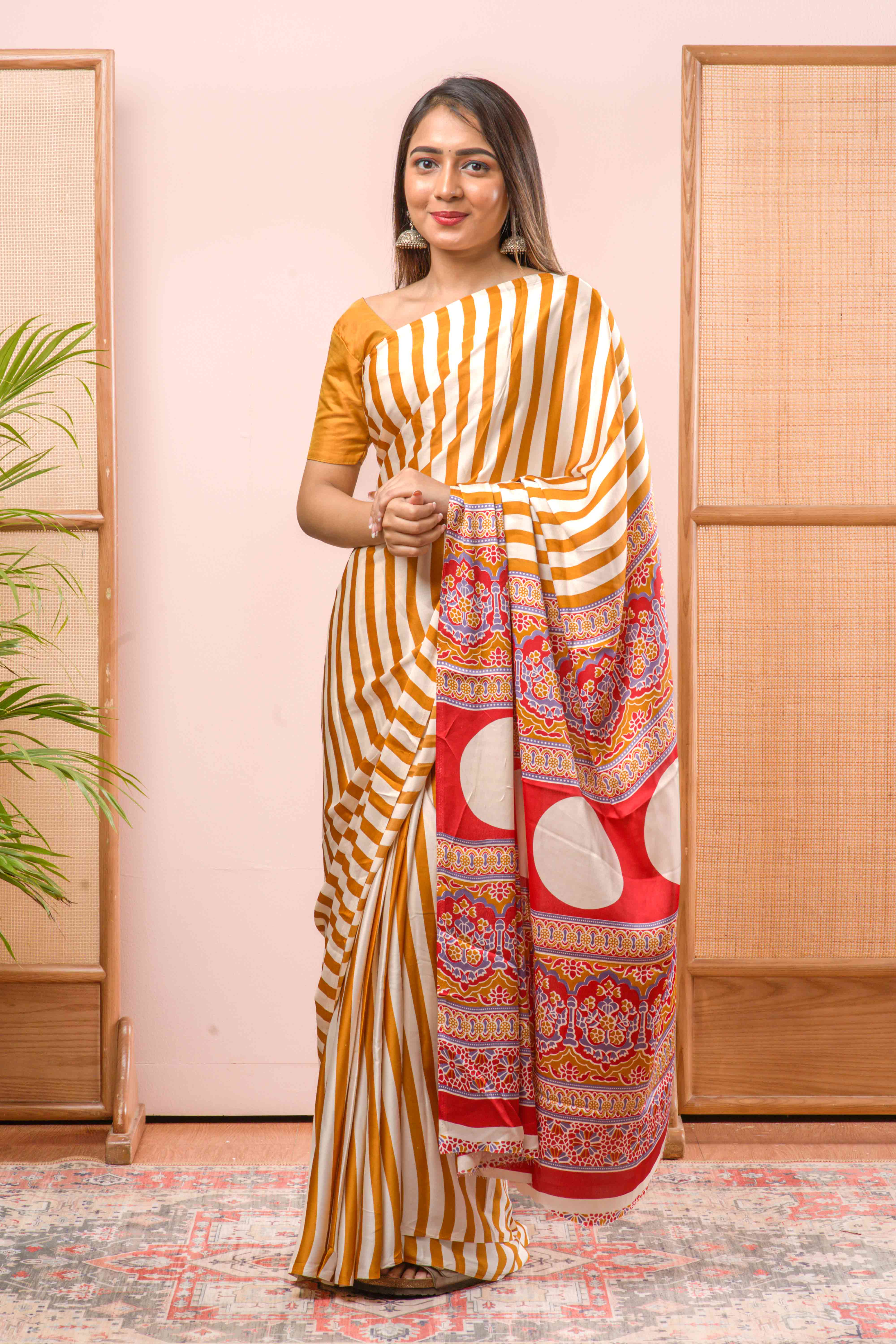 Modal Silk Sareehe Body Has Contrast Vibrant Yellow Vertical Stripes The Pallu Are Highlighted Ajrakh Design Along With Blouse