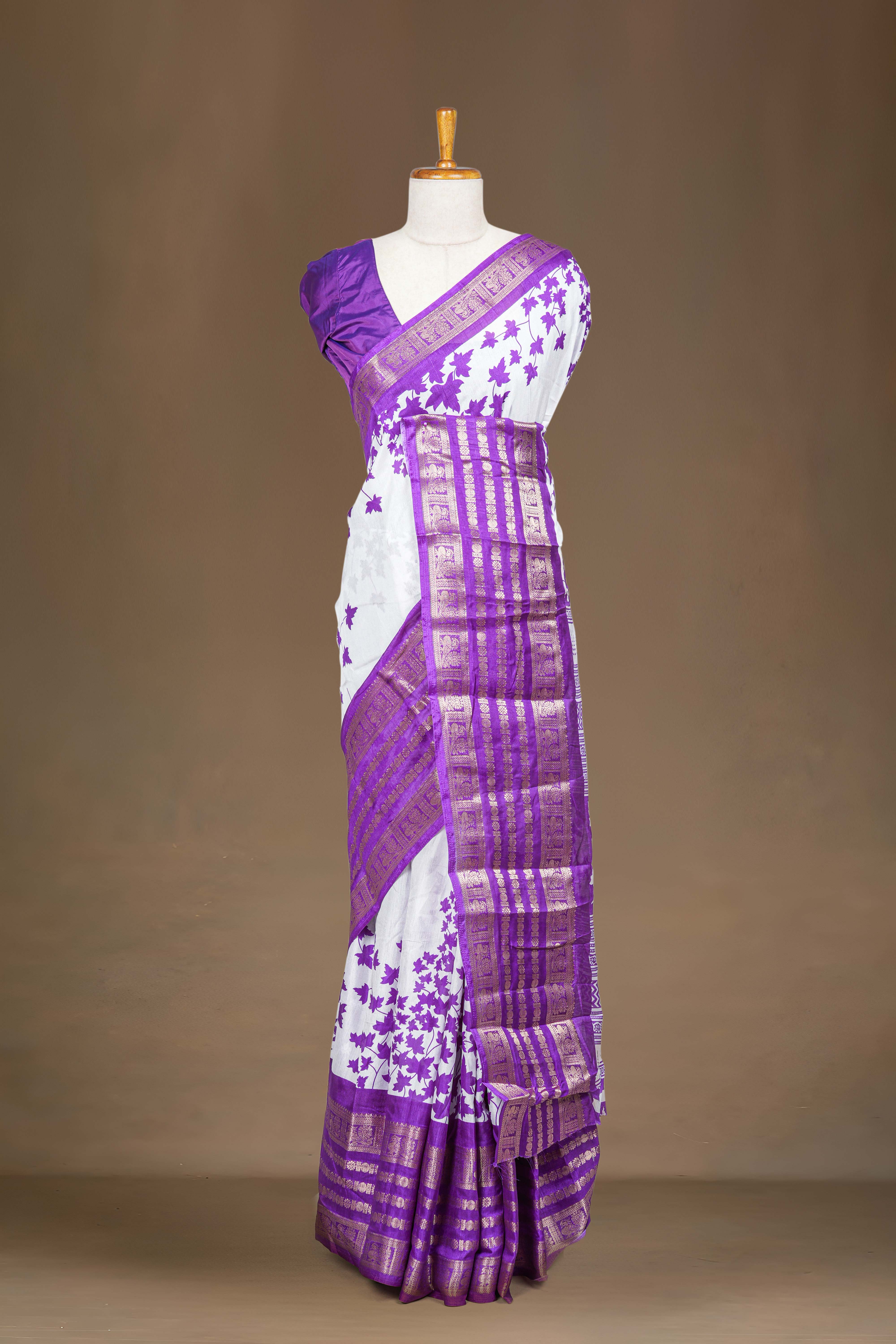 White Dola Silk Saree Leaf Motifs Across The Body With Golden Zari Weaving Border Along With Contrast Blouse