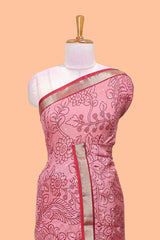 Pink assam silk abstract face print saree with contrast zari border and pallu
