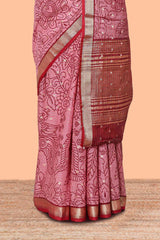Pink assam silk abstract face print saree with contrast zari border and pallu