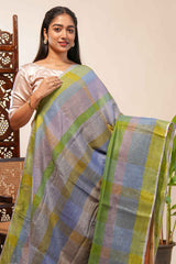 Green done Tones semi tussarall over saree Subtle Stripe and Checked pattern along with Tassels and Contrast Blouse