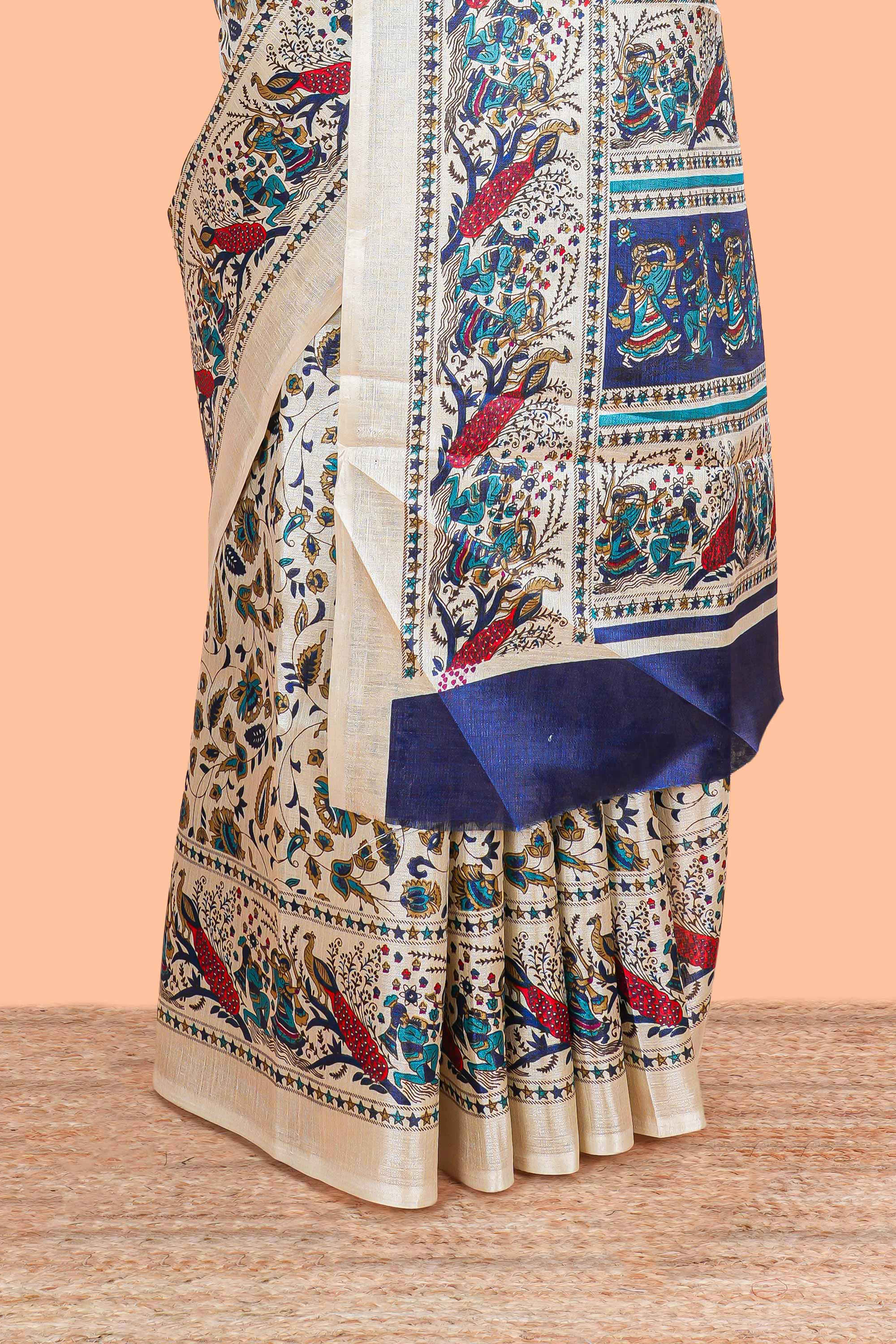 Cream south cotton saree with green kalamkari print on body, pallu contrast blue blouse